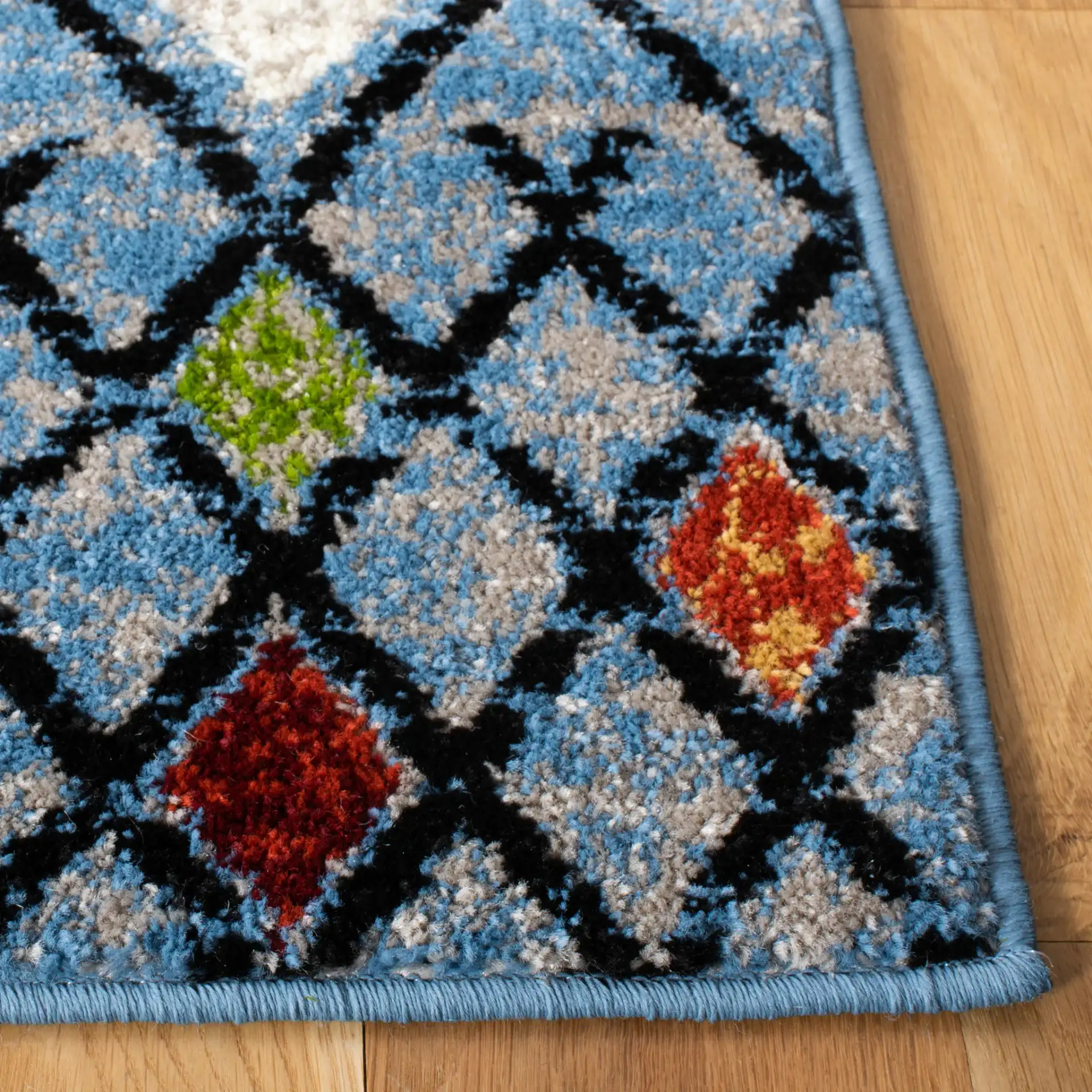 Amsterdam Banded Diamond Rug in Blue / Ivory in a styled room