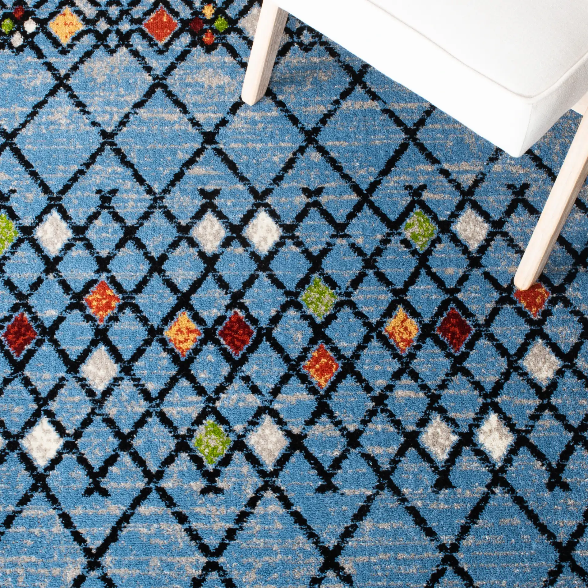 Amsterdam Banded Diamond Rug in Blue / Ivory in a styled room