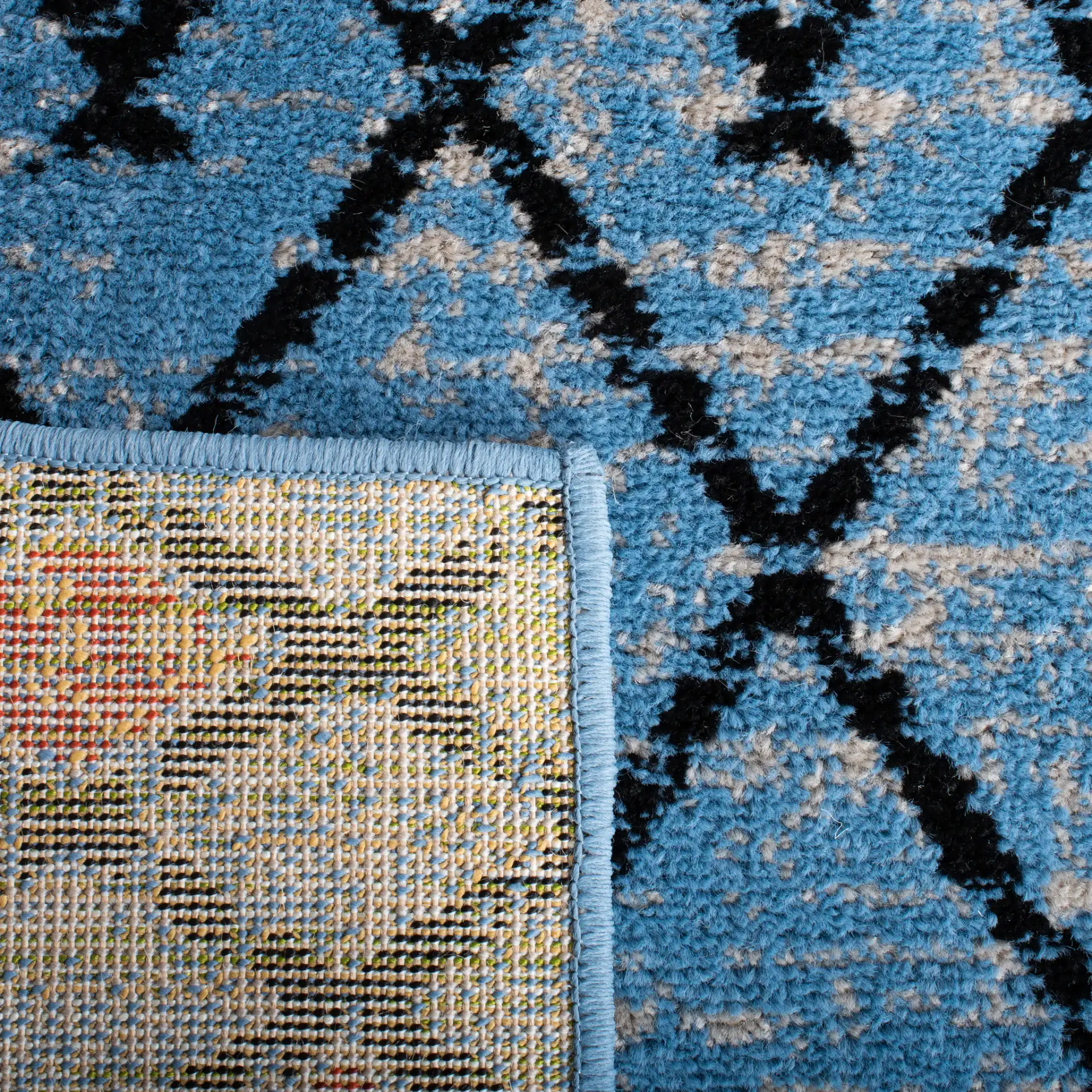 Amsterdam Banded Diamond Rug in Blue / Ivory in a styled room