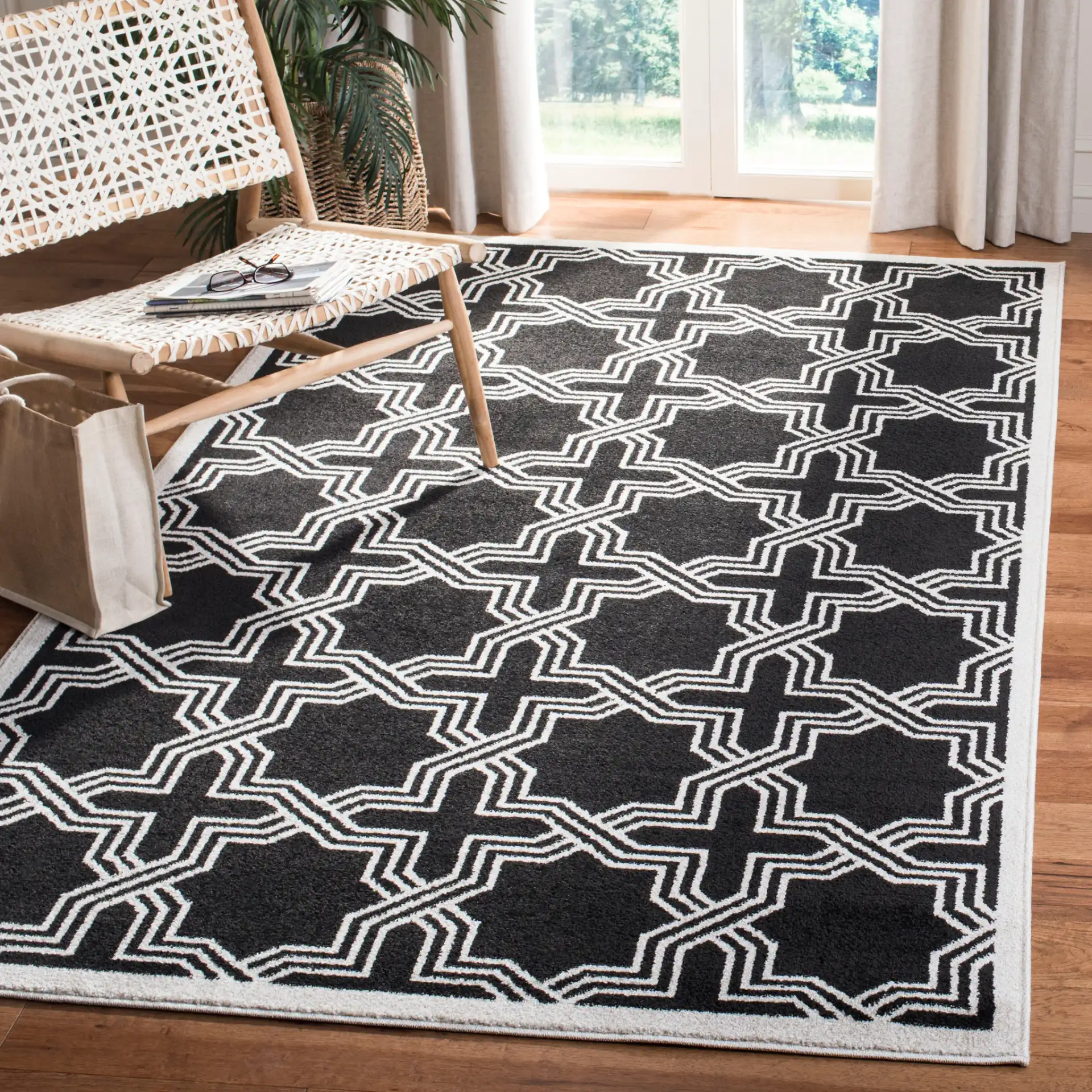 Amherst Interlocking Trellis Rug in Anthracite / Ivory in a styled room