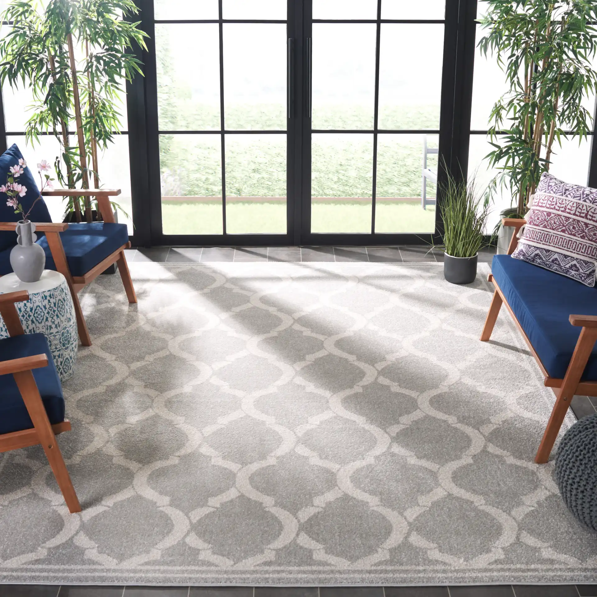 Amherst Trellis Bordered Rug in Light Gray / Ivory in a styled room