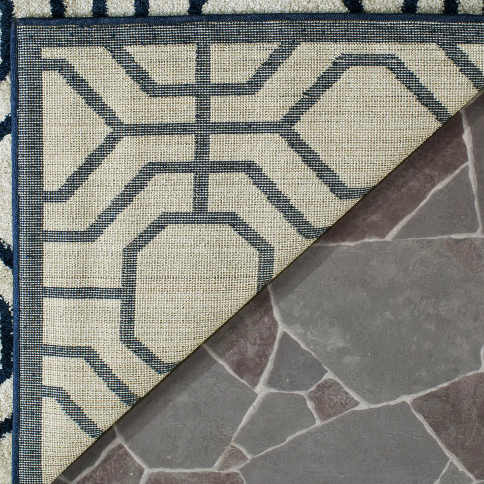 Amherst Interlocking Lattice Rug in Ivory / Navy in a styled room