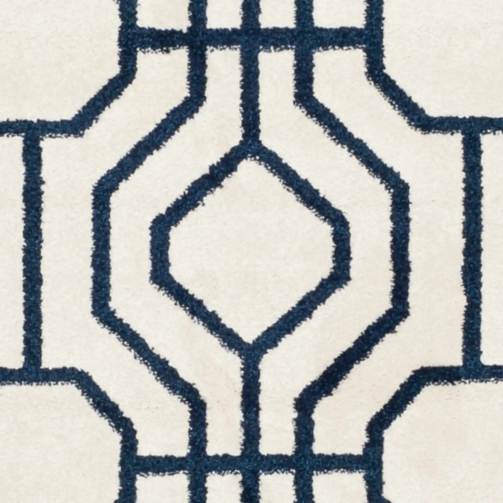Amherst Interlocking Lattice Rug in Ivory / Navy in a styled room