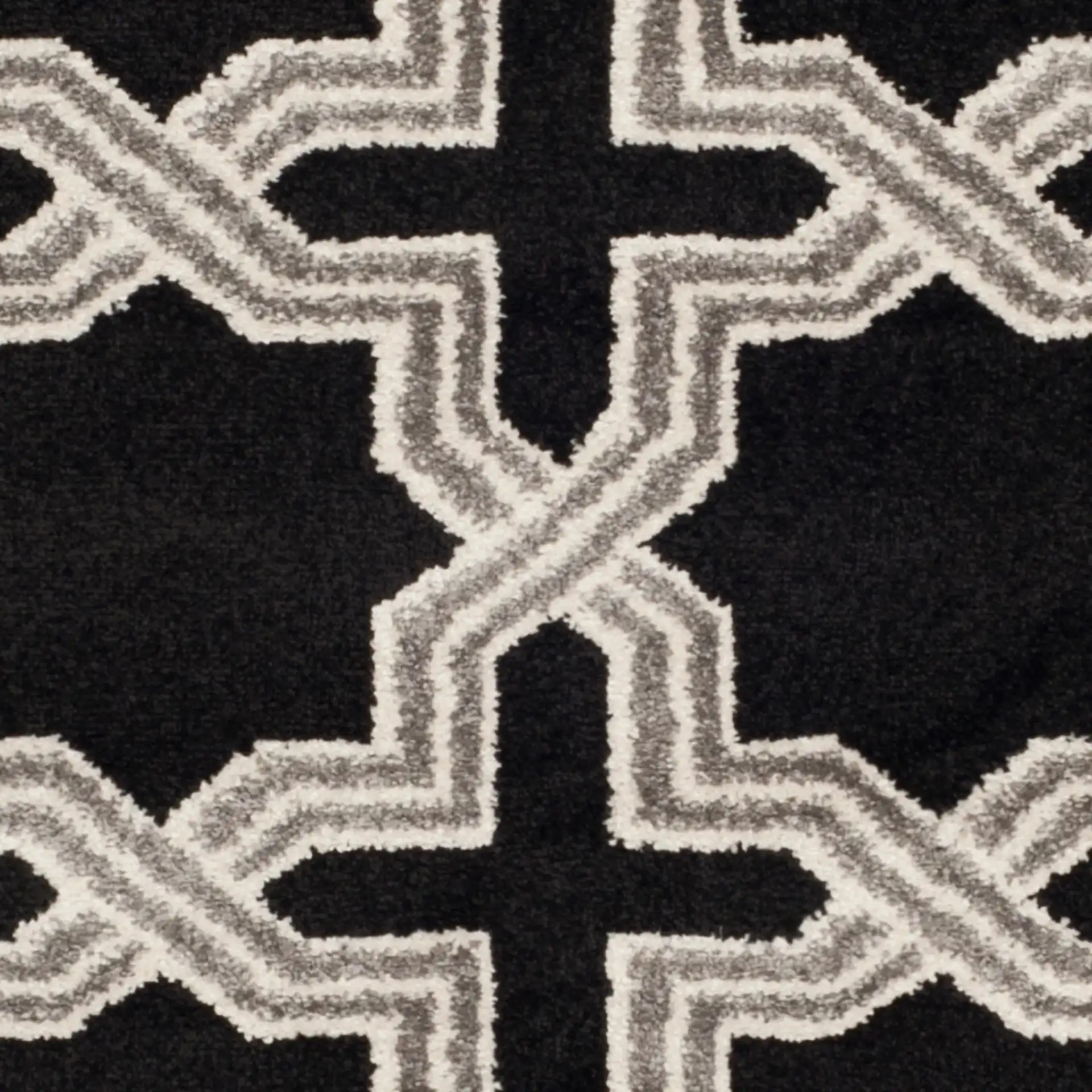 Amherst Interlocking Trellis Rug in Anthracite / Gray in a styled room