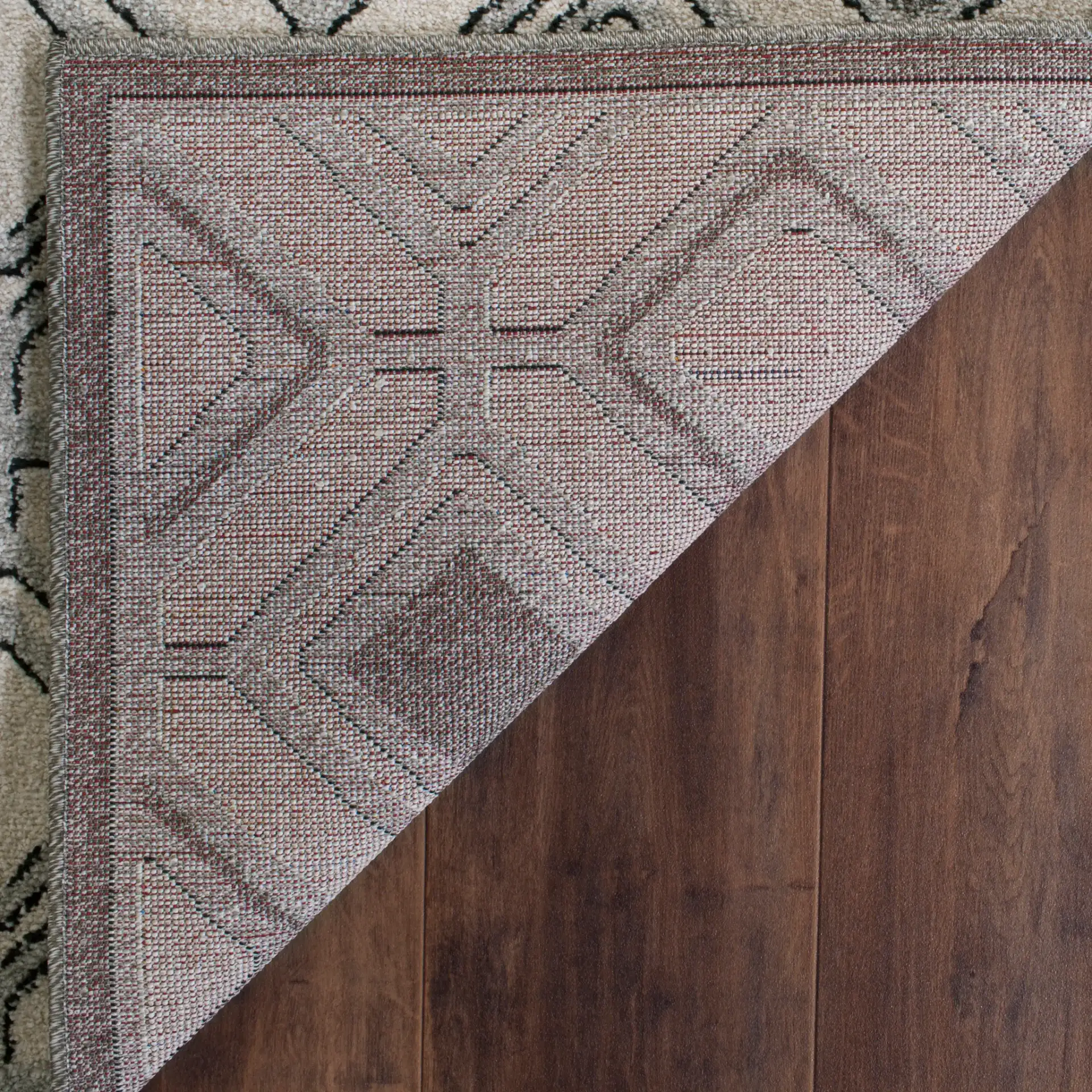 Amherst Interlocking Diamond Rug in Ivory / Light Gray in a styled room