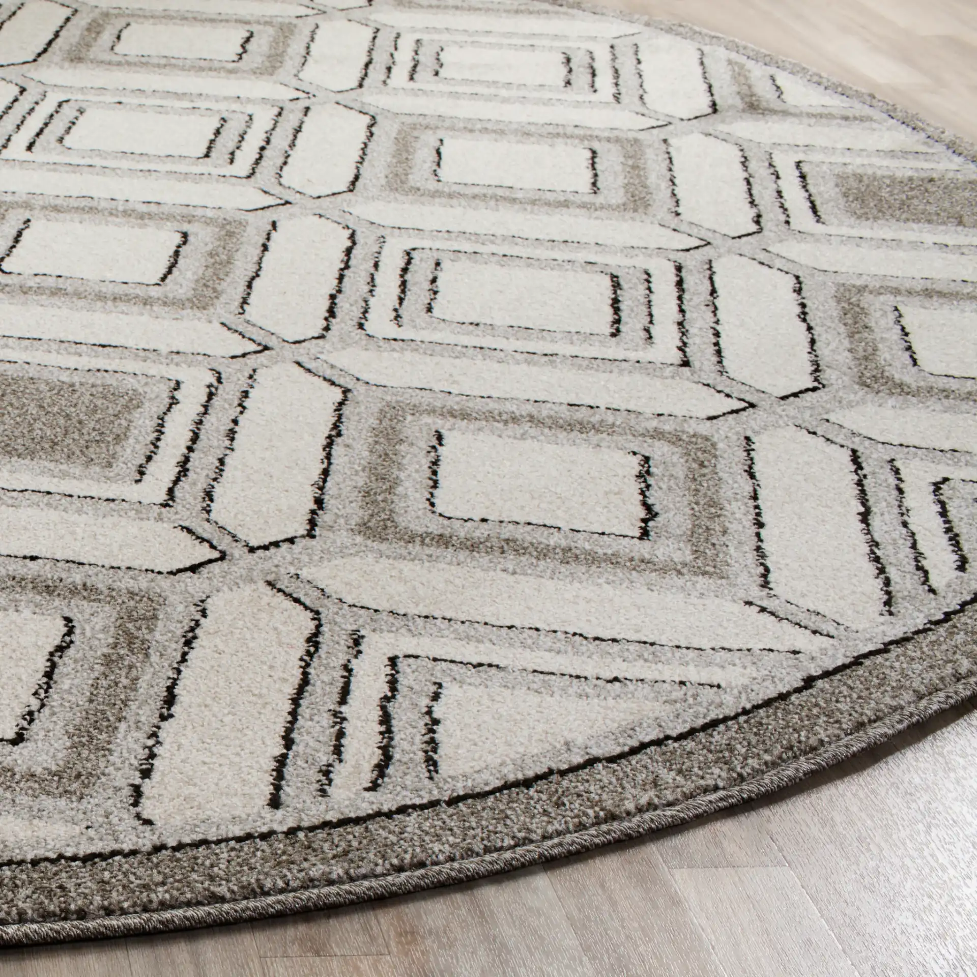 Amherst Interlocking Diamond Rug in Ivory / Light Gray in a styled room