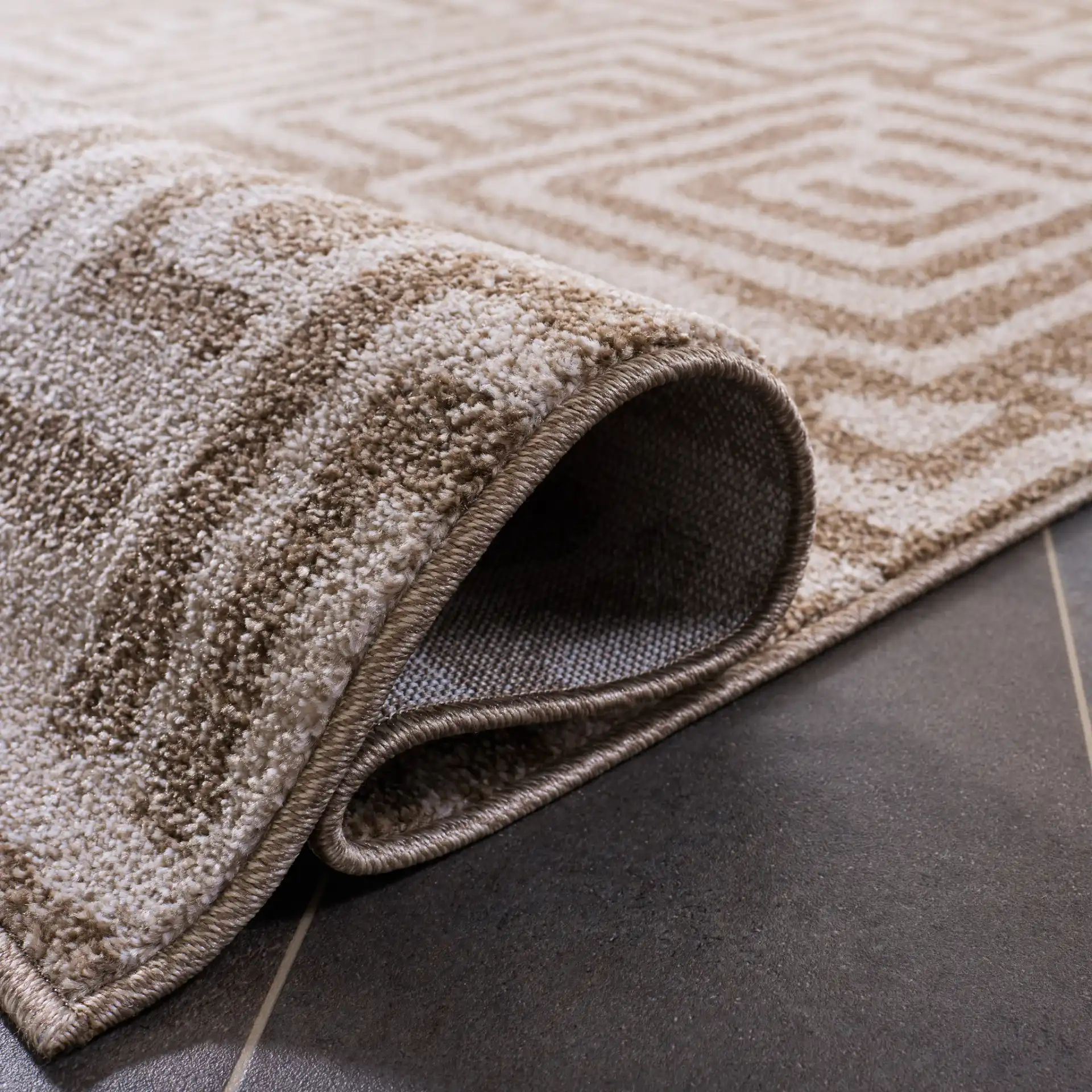 Amherst Interlocking Maze Rug in Beige / Cream in a styled room