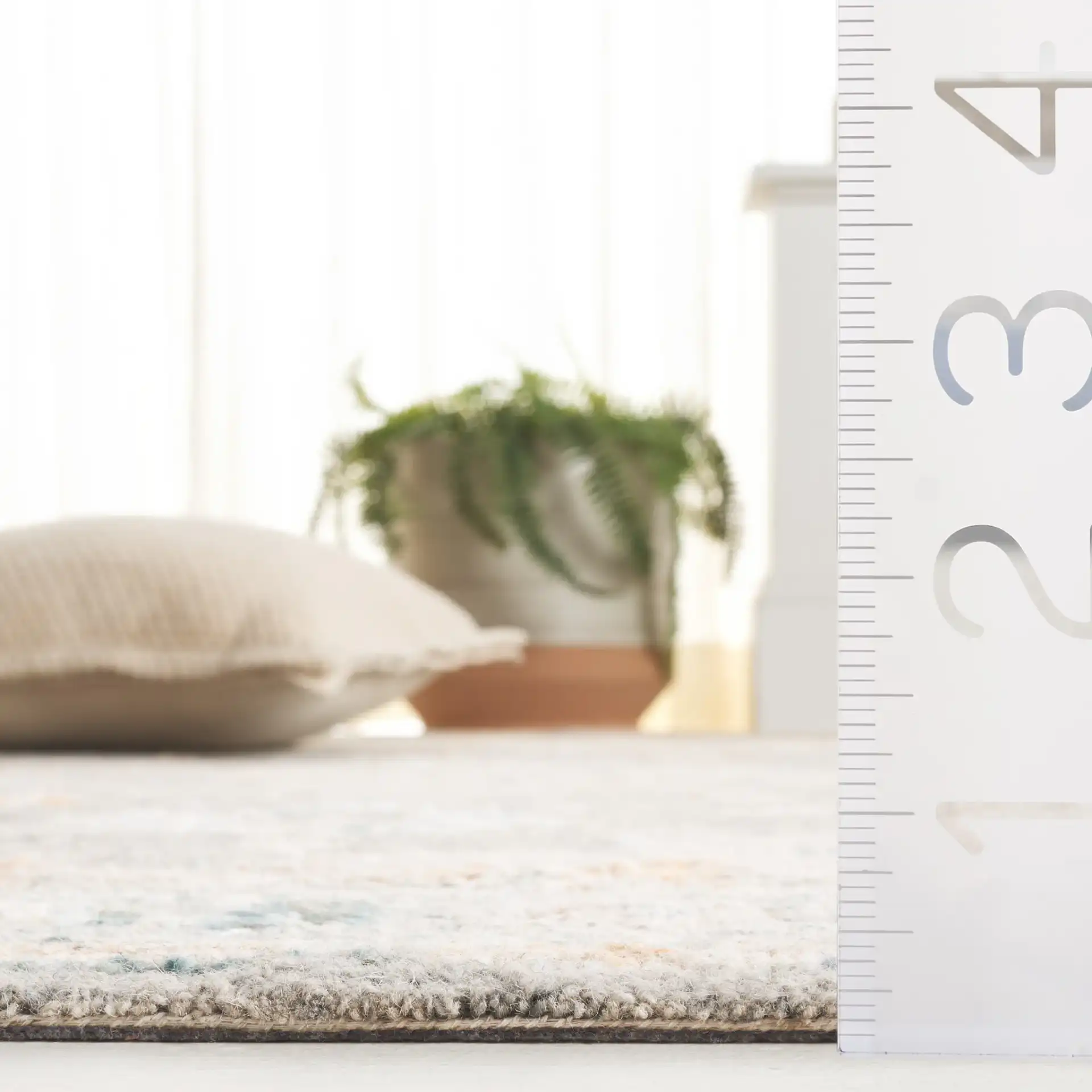 Anatolia Stepped Medallion Hand-Tufted Wool Rug in Gray / Rust in a styled room