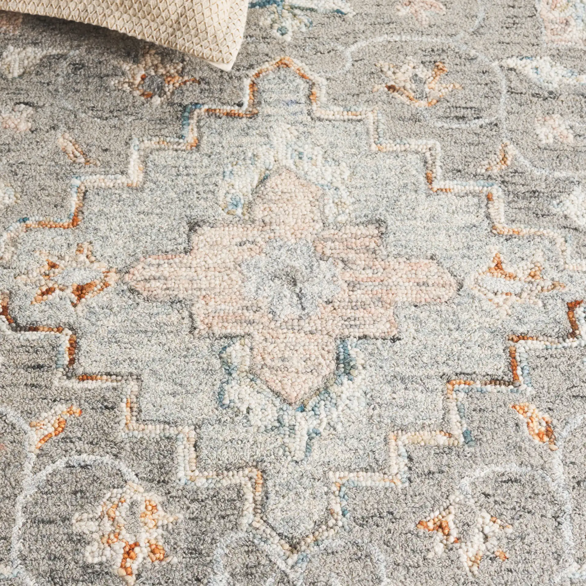 Anatolia Stepped Medallion Hand-Tufted Wool Rug in Gray / Rust in a styled room
