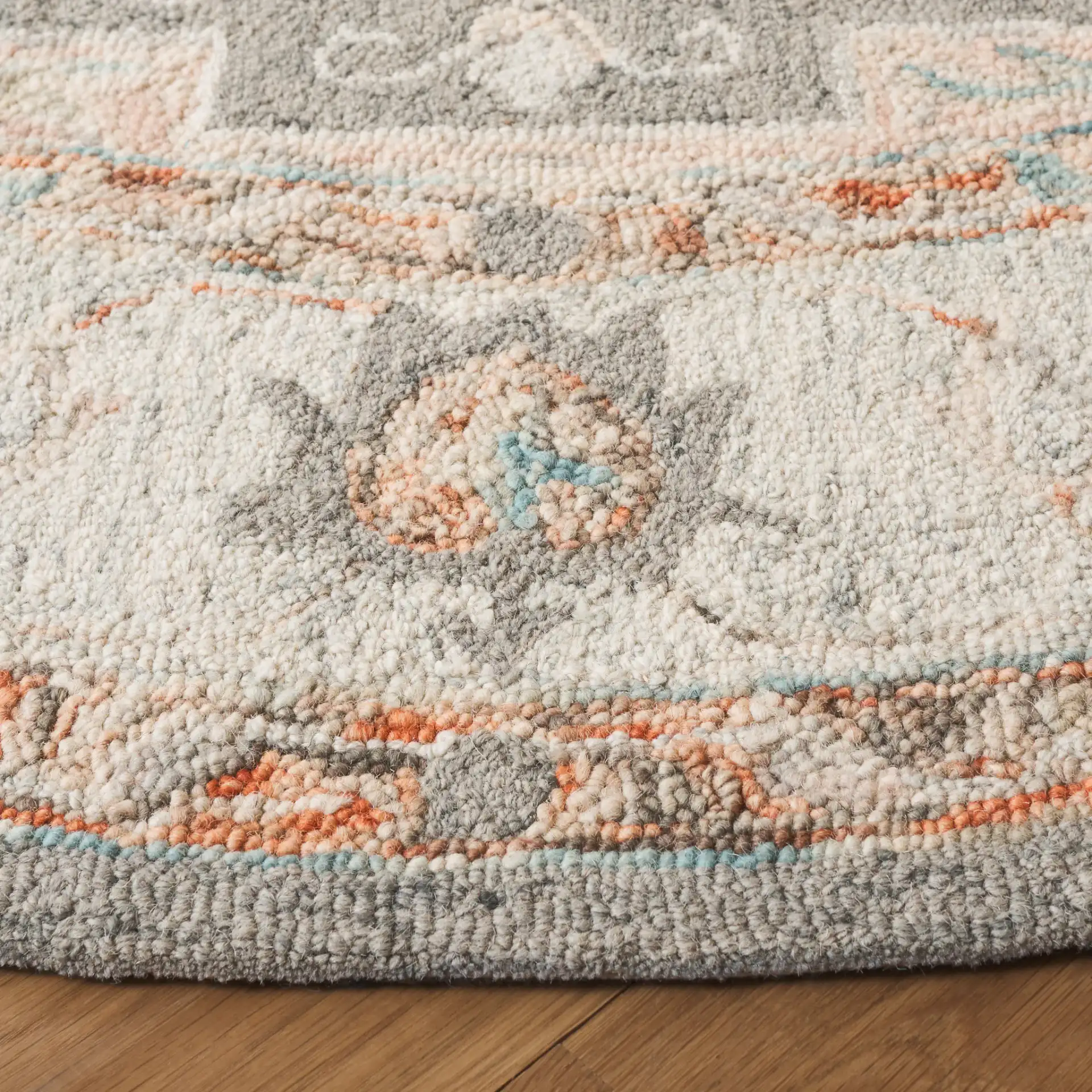 Anatolia Stepped Medallion Hand-Tufted Wool Rug in Gray / Rust in a styled room