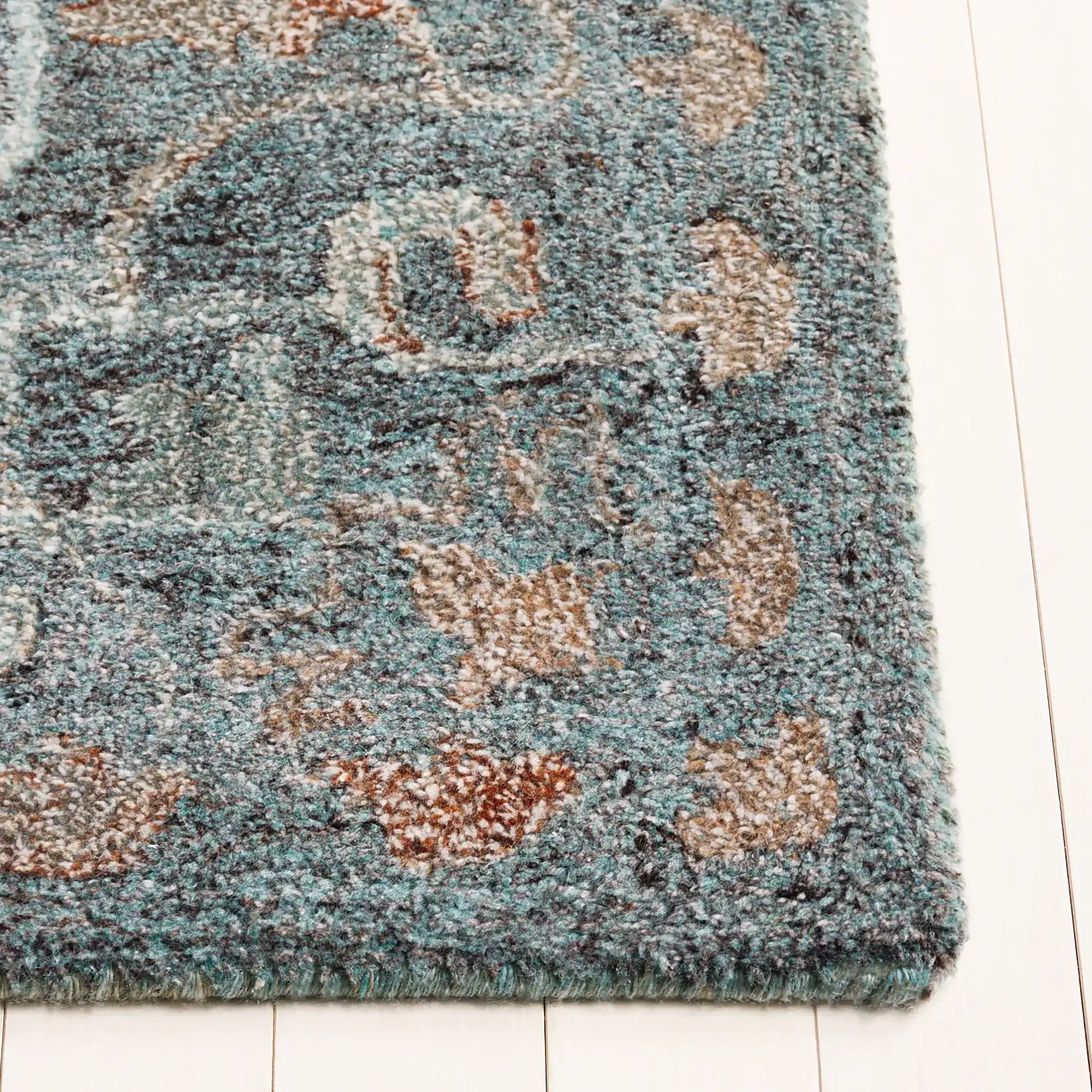 Anatolia Stepped Medallion Hand-Tufted Rug in Teal / Brown in a styled room