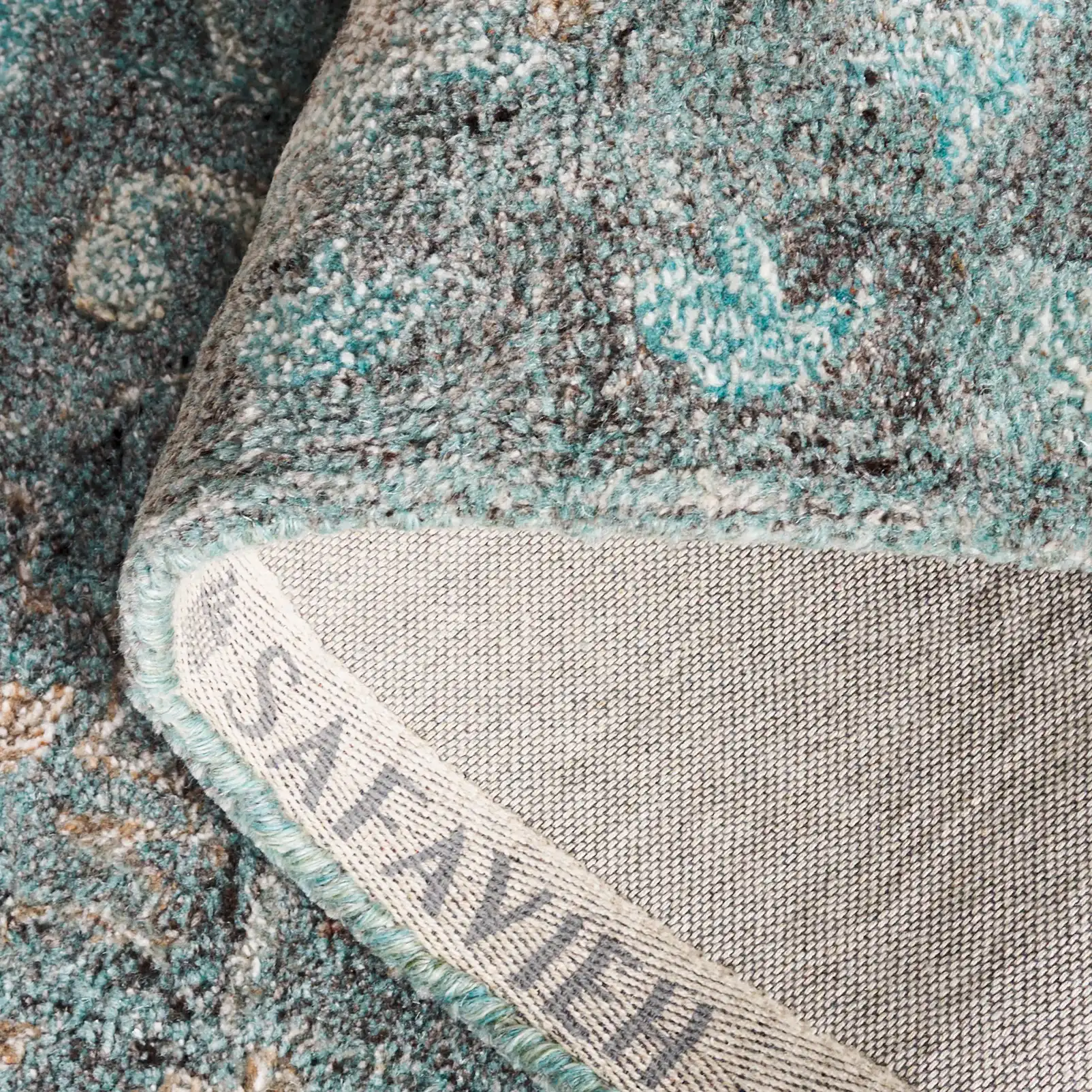 Anatolia Stepped Medallion Hand-Tufted Rug in Teal / Brown in a styled room