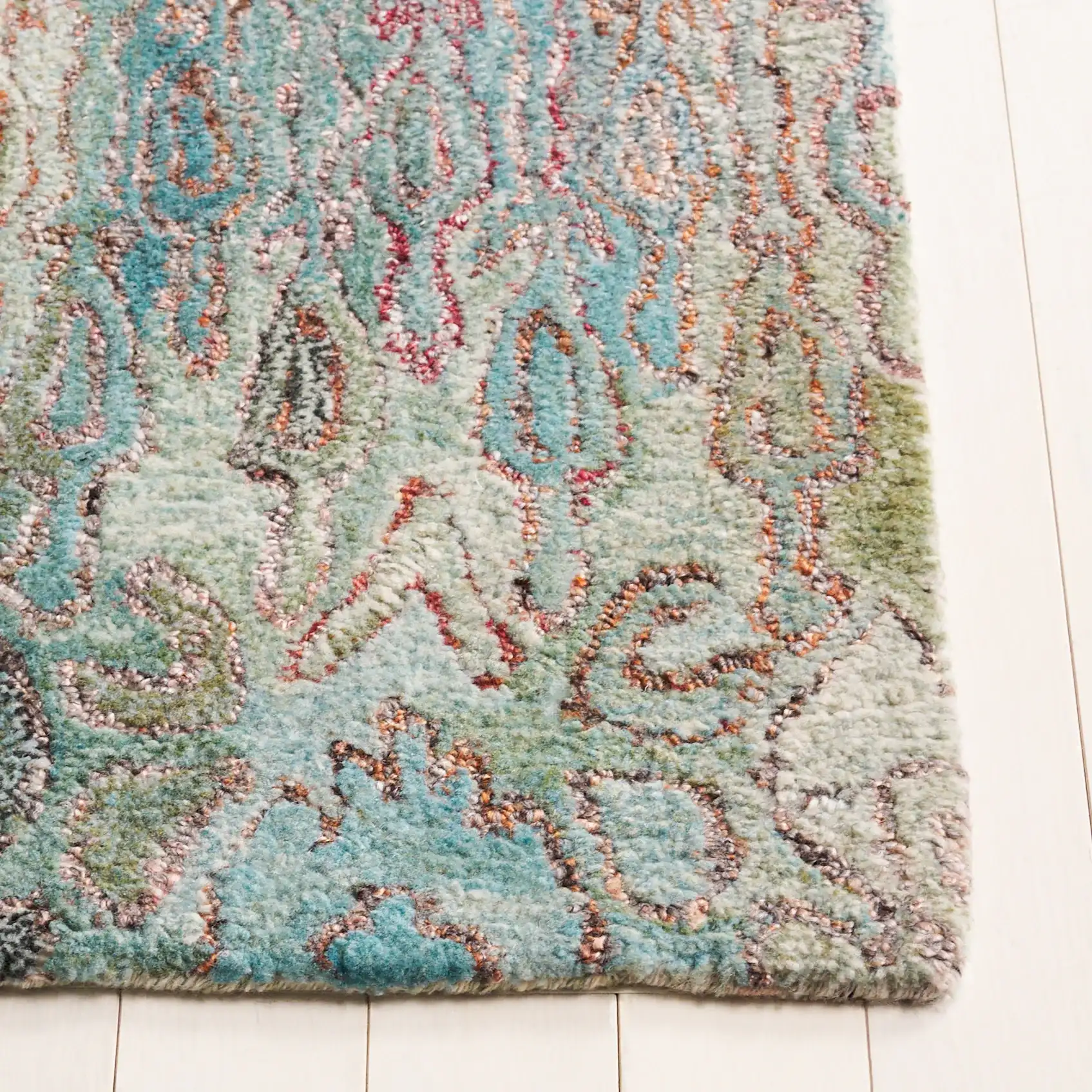 Anatolia Patchwork Hand-Tufted Rug in Teal / Green in a styled room