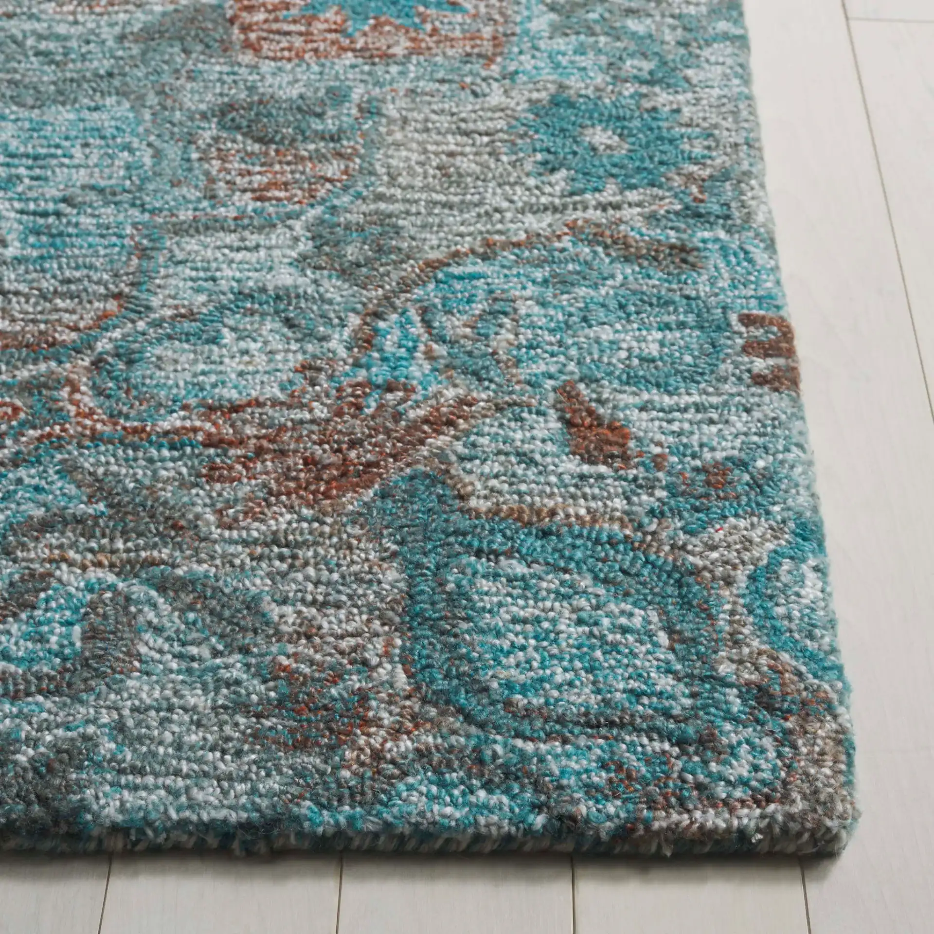 Anatolia Floral Medallion Hand-Tufted Rug in Turquoise / Brown in a styled room