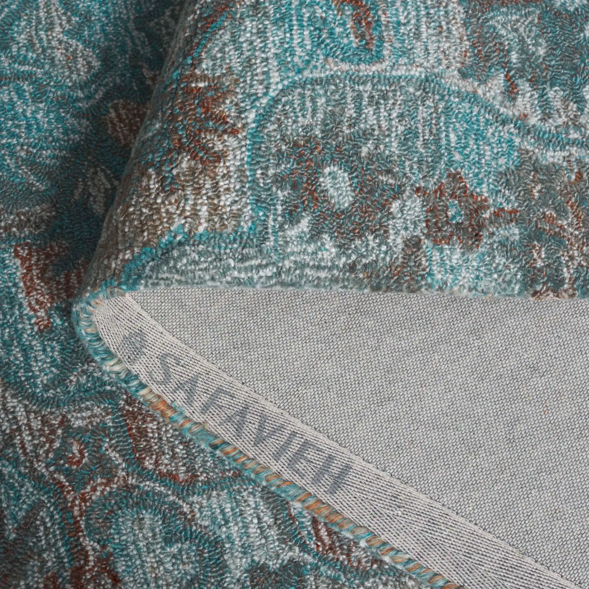 Anatolia Floral Medallion Hand-Tufted Rug in Turquoise / Brown in a styled room