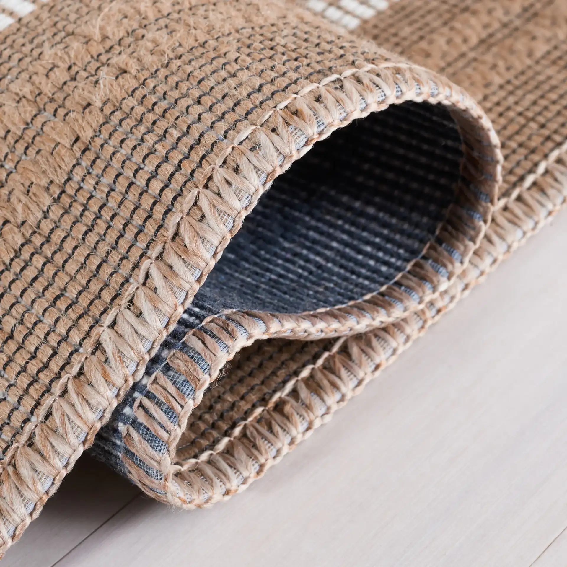 Aspect Bordered Checkerboard Jute Rug in Natural / Ivory in a styled room