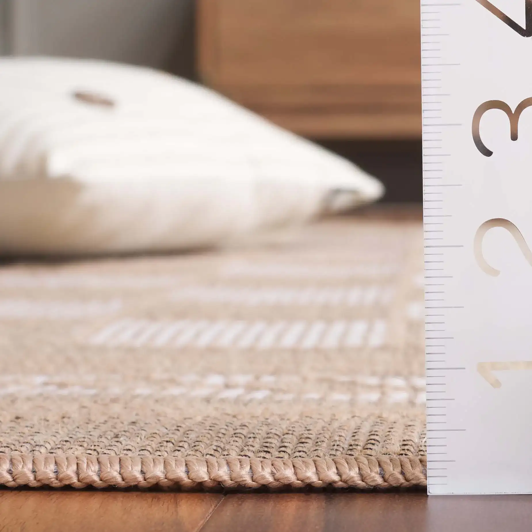 Aspect Bordered Checkerboard Jute Rug in Natural / Ivory in a styled room