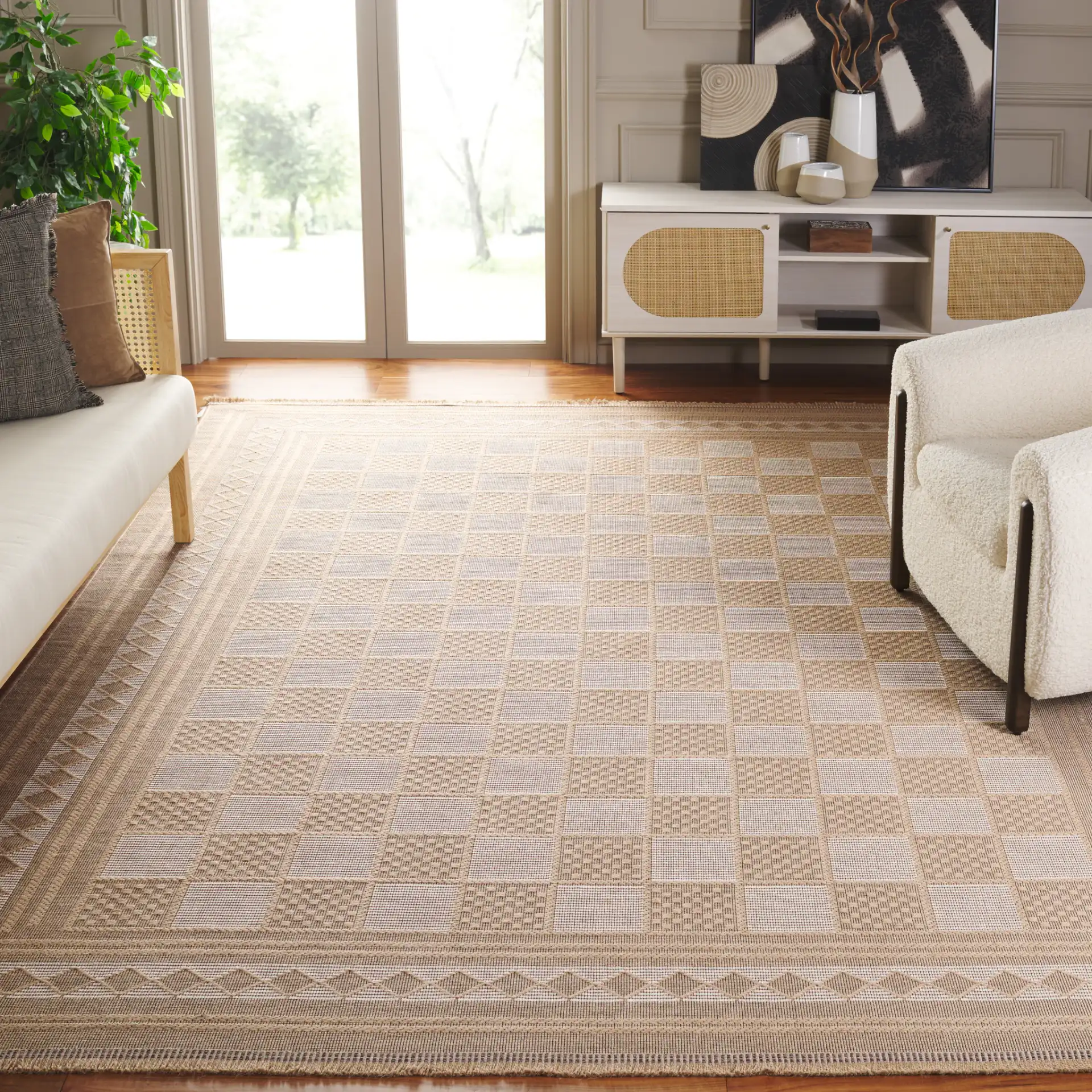 Aspect Bordered Checkerboard Jute Rug in Natural / Ivory in a styled room