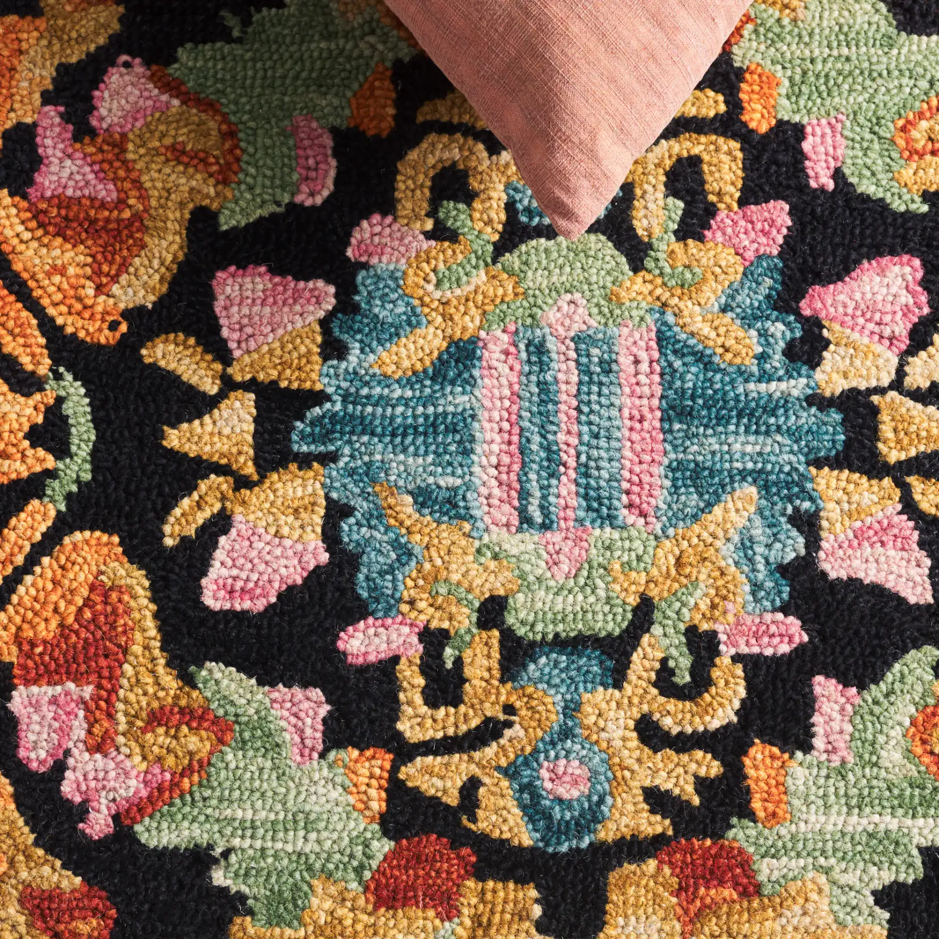 Aspen Mosaic Medallion Hand-Tufted Wool Rug in Black / Rust in a styled room