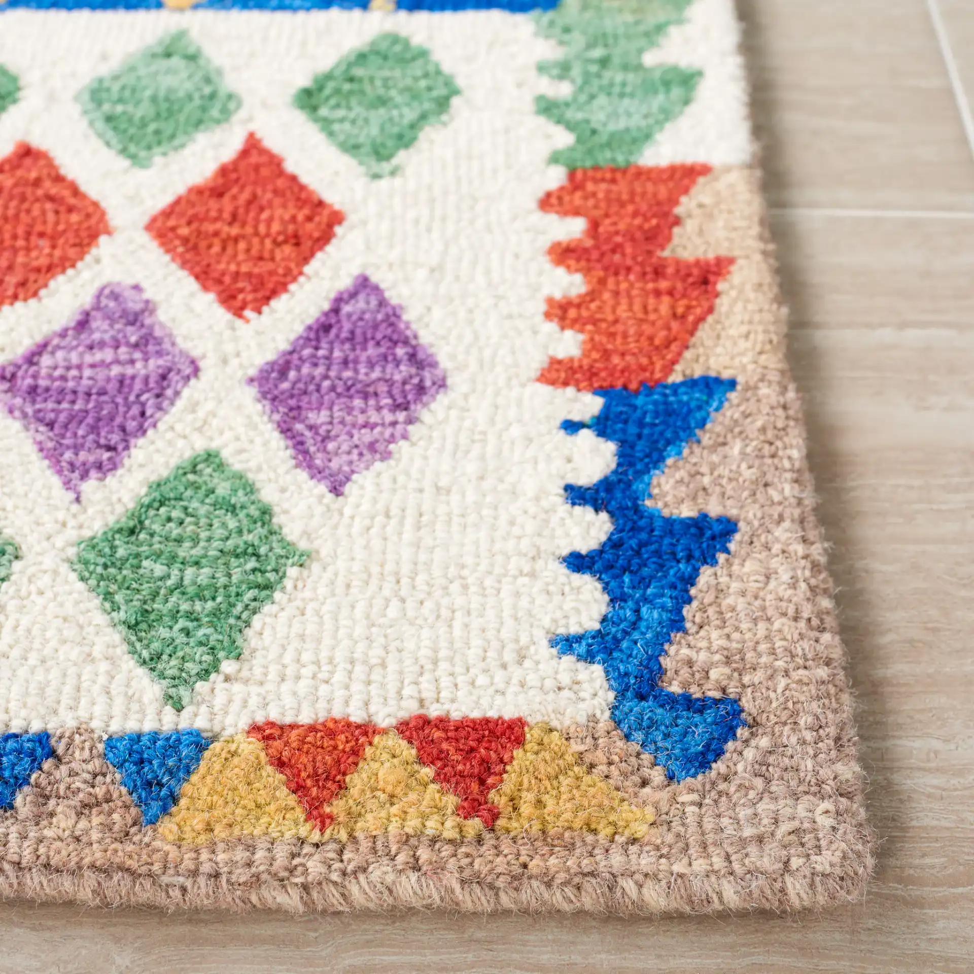 Aspen Patchwork Diamond Hand-Tufted Wool Rug in Red / Blue in a styled room