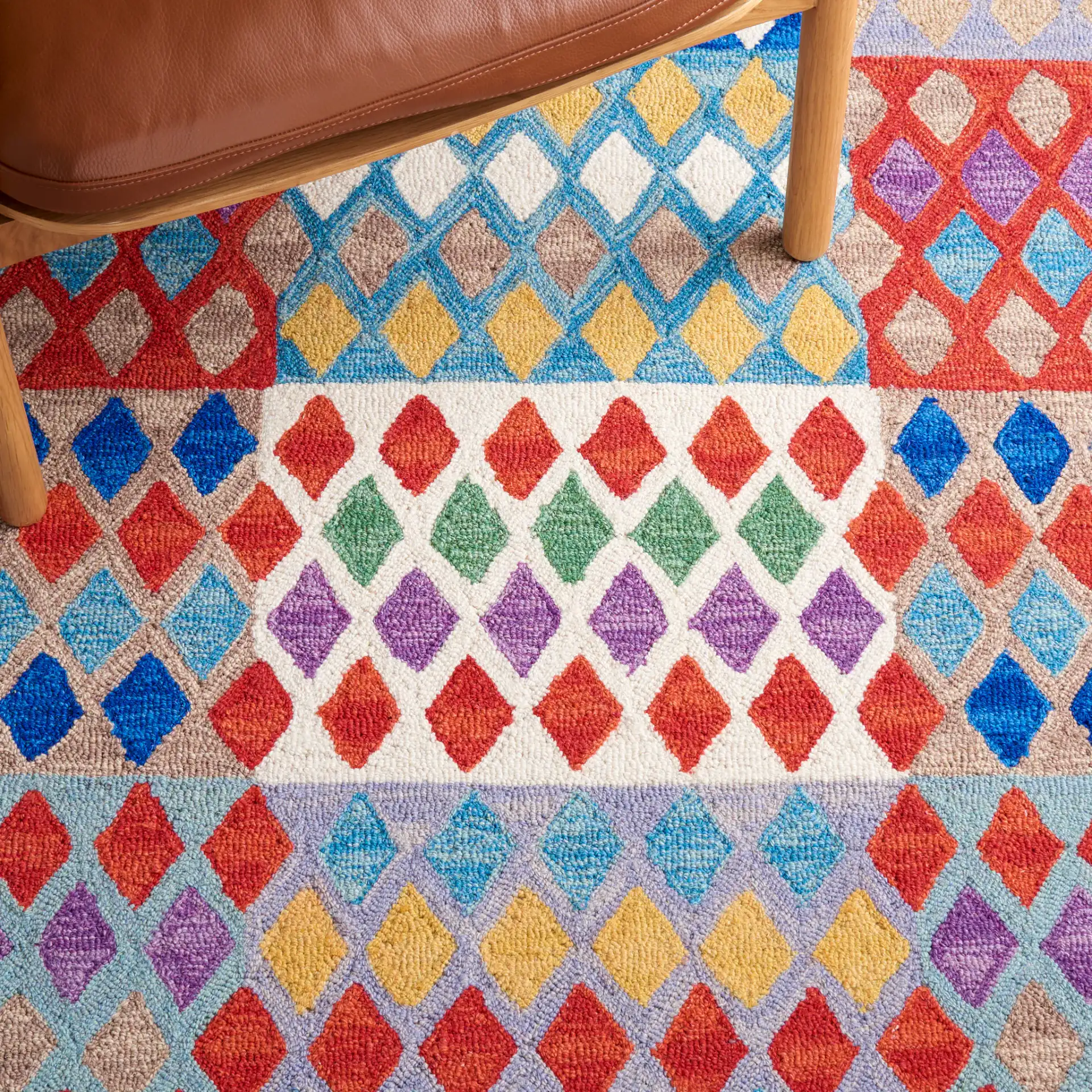 Aspen Patchwork Diamond Hand-Tufted Wool Rug in Red / Blue in a styled room