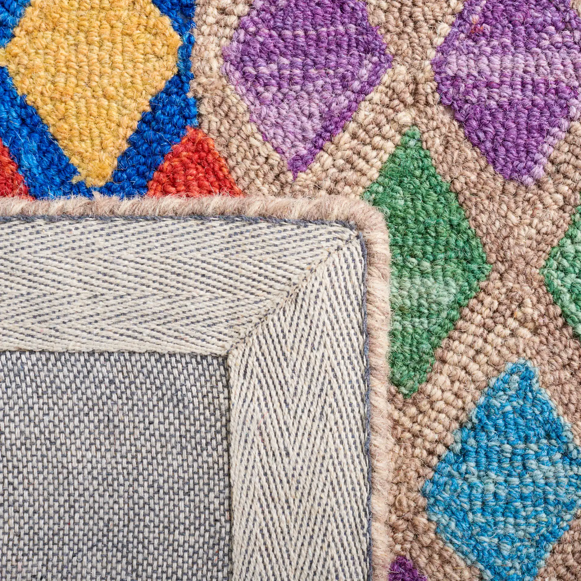 Aspen Patchwork Diamond Hand-Tufted Wool Rug in Red / Blue in a styled room