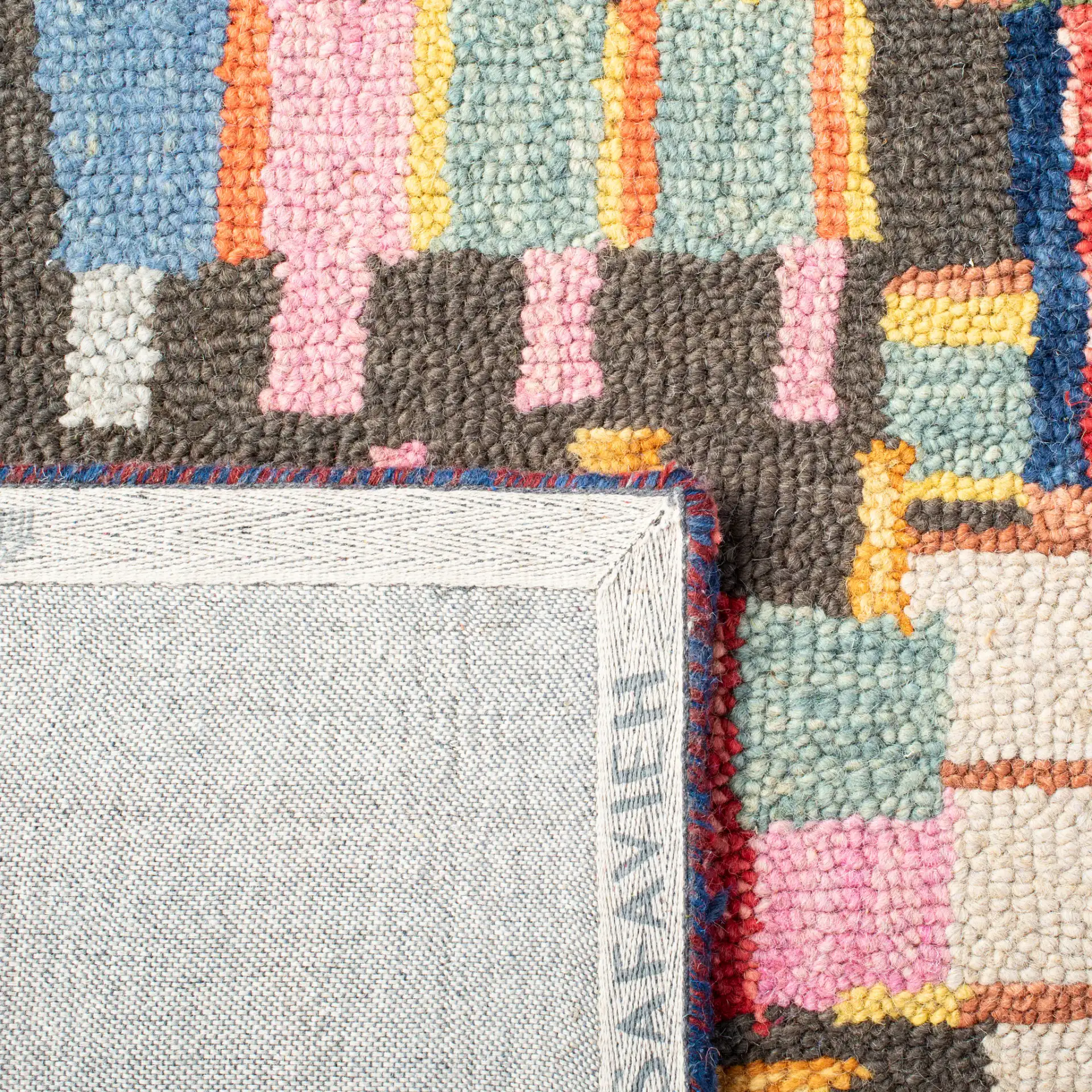 Aspen Patchwork Grid Hand-Tufted Wool Rug in Ivory / Black in a styled room