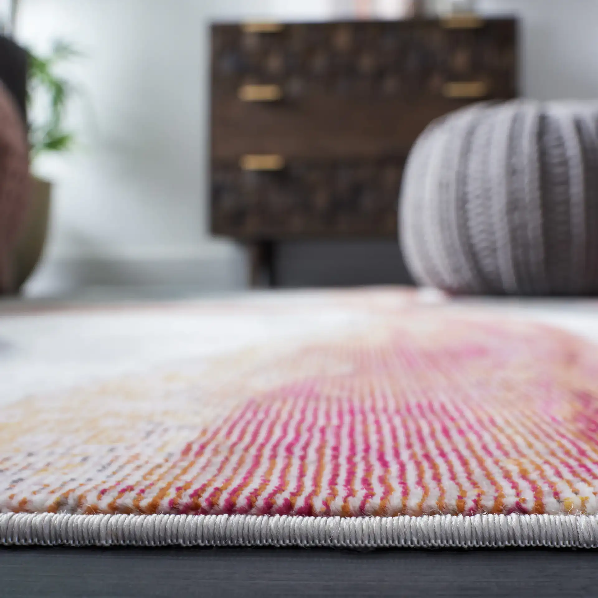 Aria Sweeping Abstract Rug in Ivory / Plum in a styled room