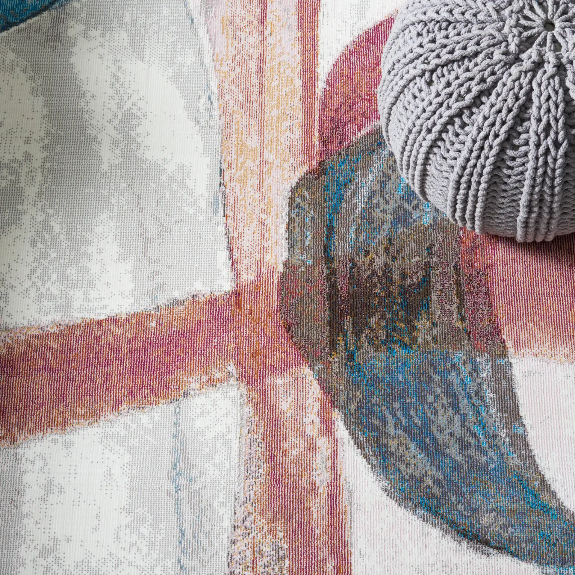 Aria Sweeping Abstract Rug in Ivory / Plum in a styled room