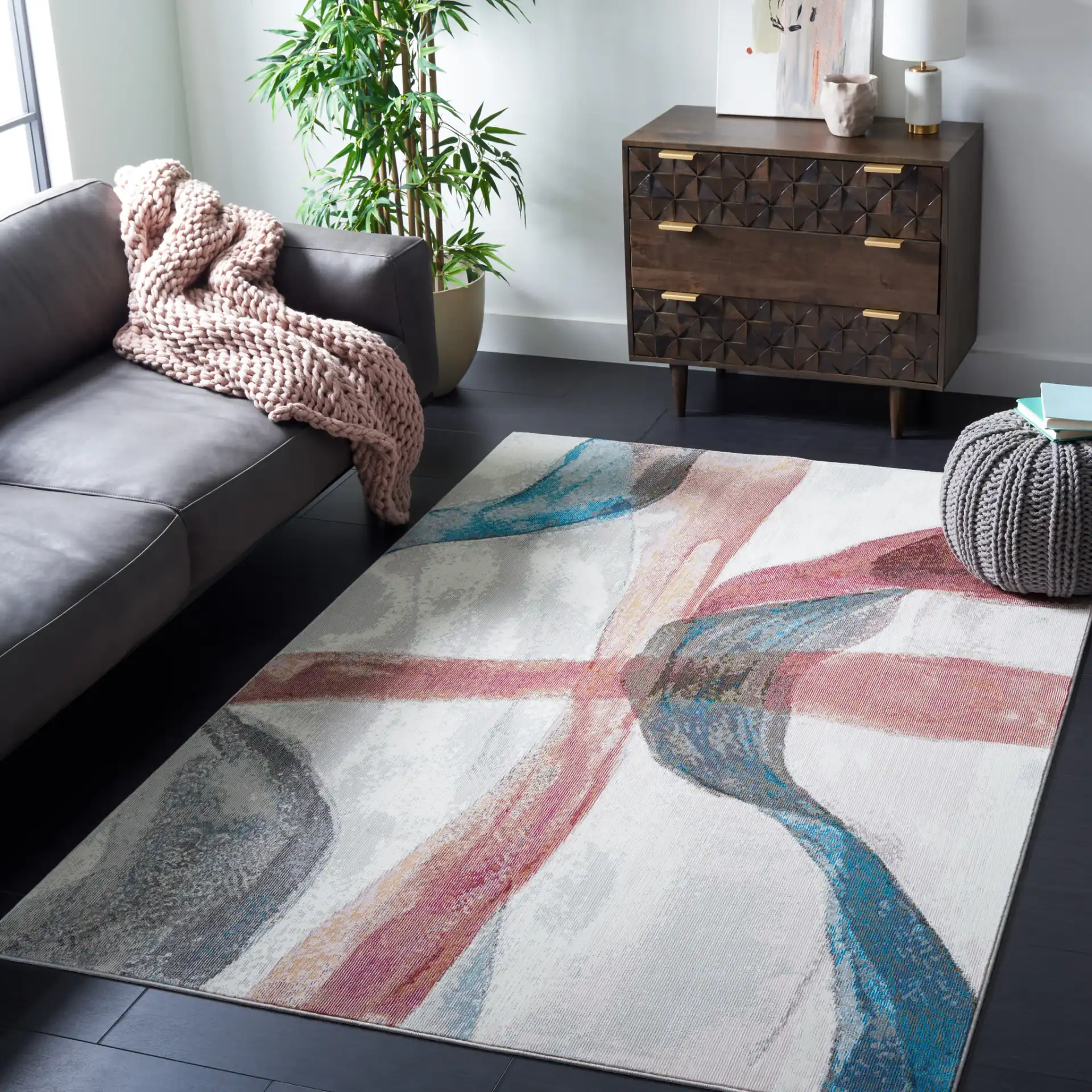 Aria Sweeping Abstract Rug in Ivory / Plum in a styled room