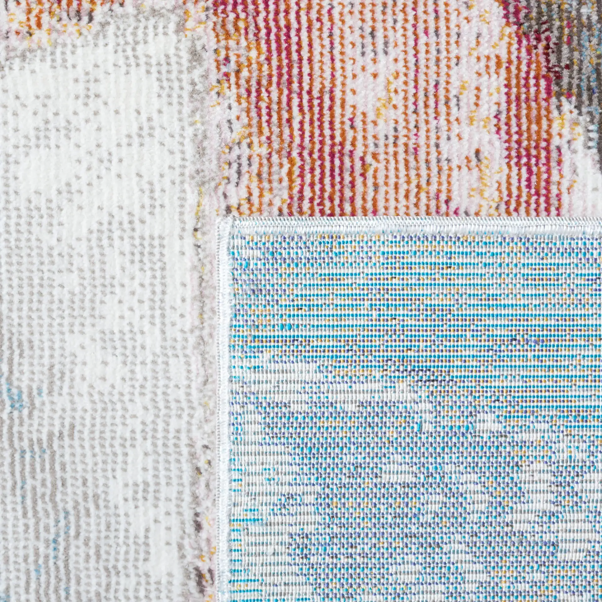 Aria Sweeping Abstract Rug in Ivory / Plum in a styled room