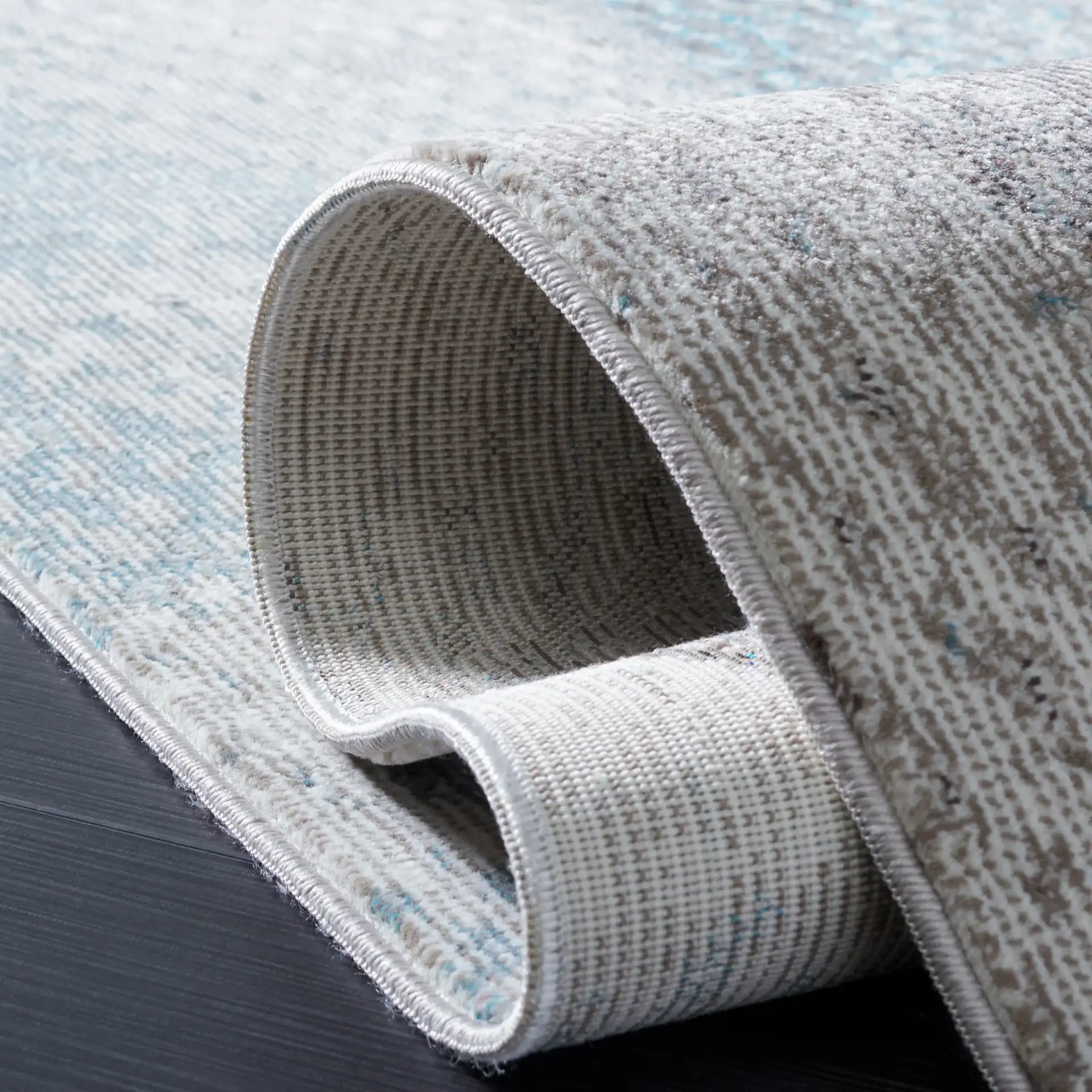 Aria Abstract Painterly Rug in Ivory / Navy in a styled room