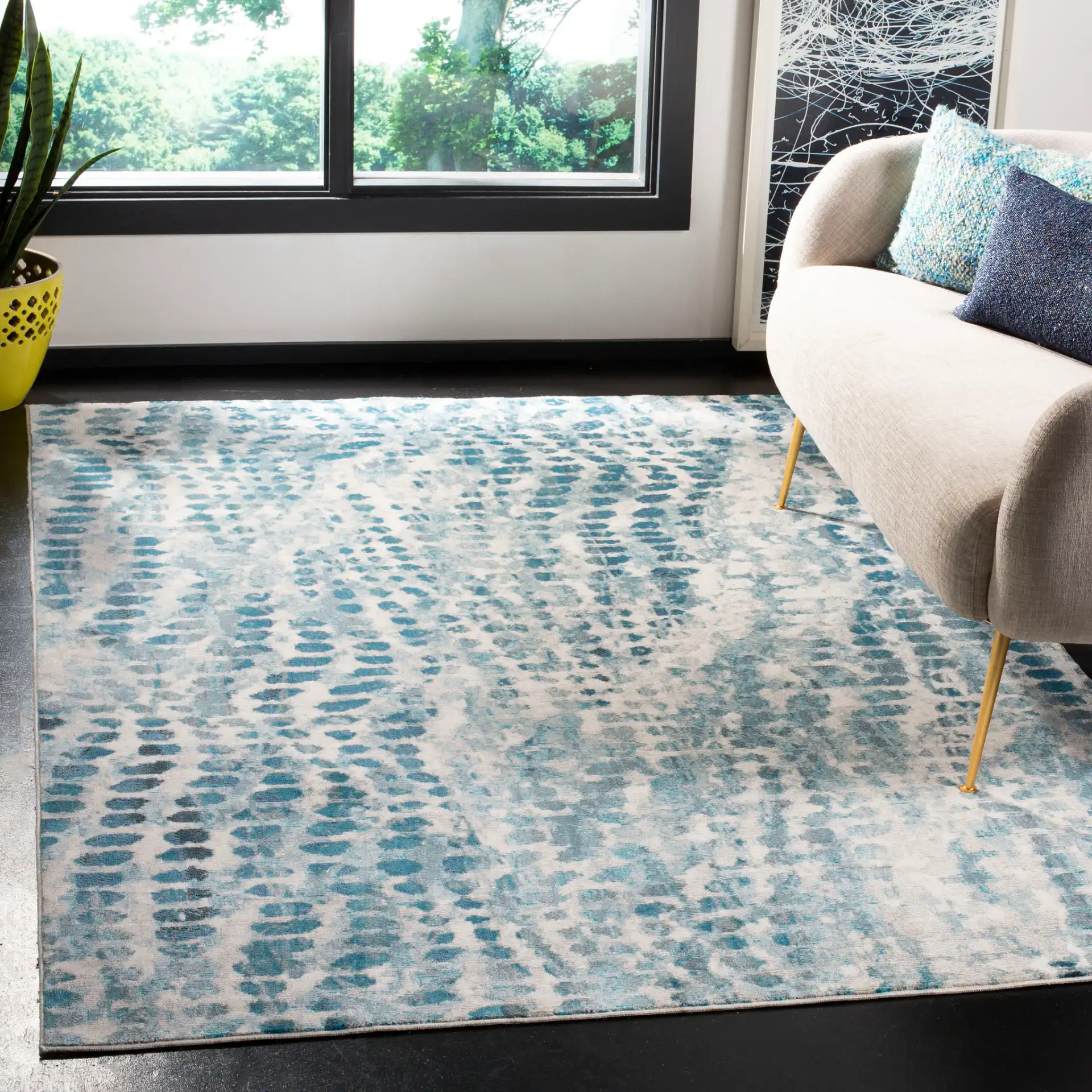 Aria Dotted Wave Rug in Cream / Teal in a styled room