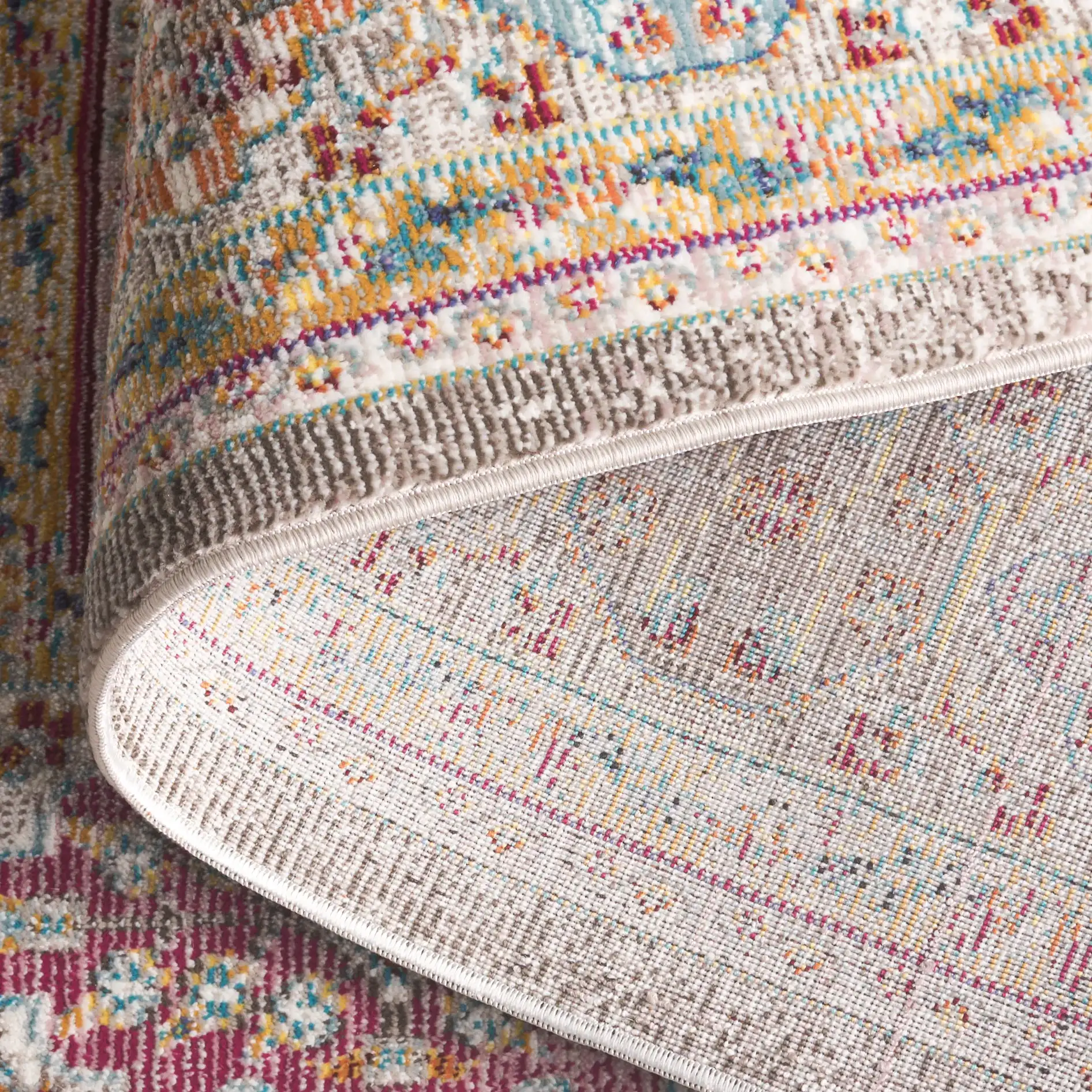 Aria Tile Patchwork Rug in Cream / Multicolor in a styled room