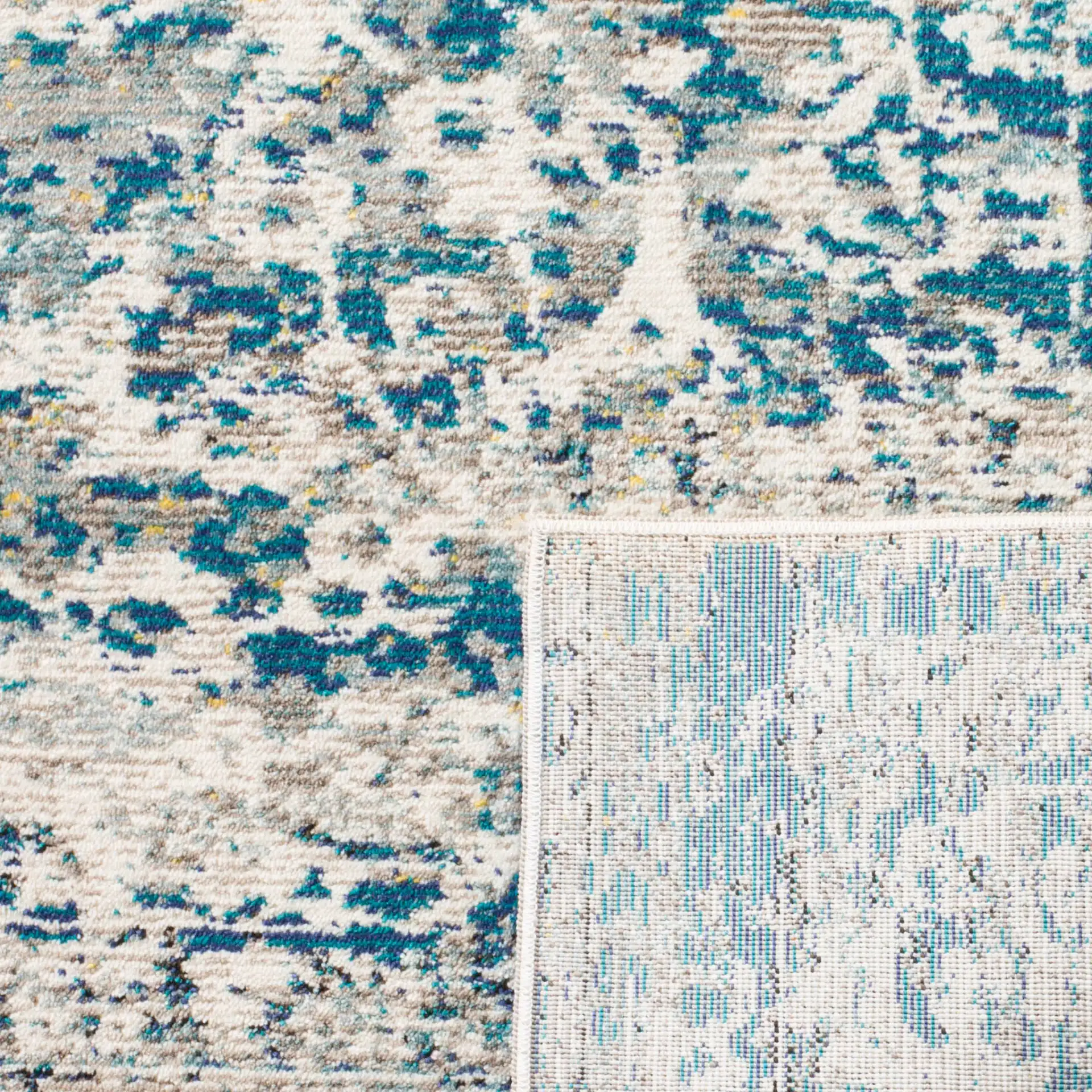 Aria Distressed Scroll Rug in Blue / Cream in a styled room