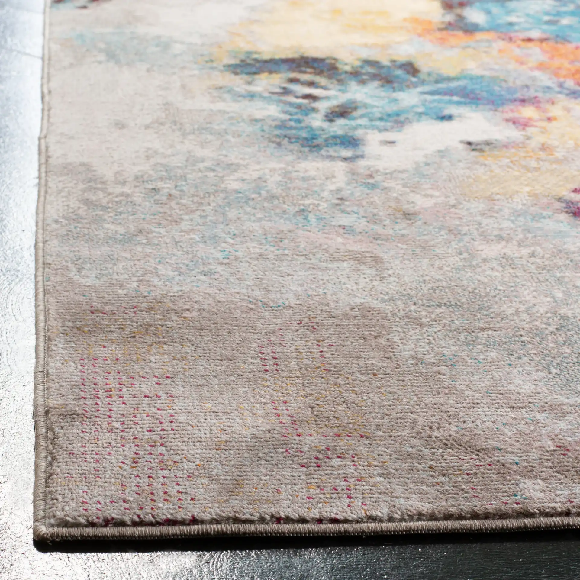 Aria Abstract Rug in Gray / Wine in a styled room