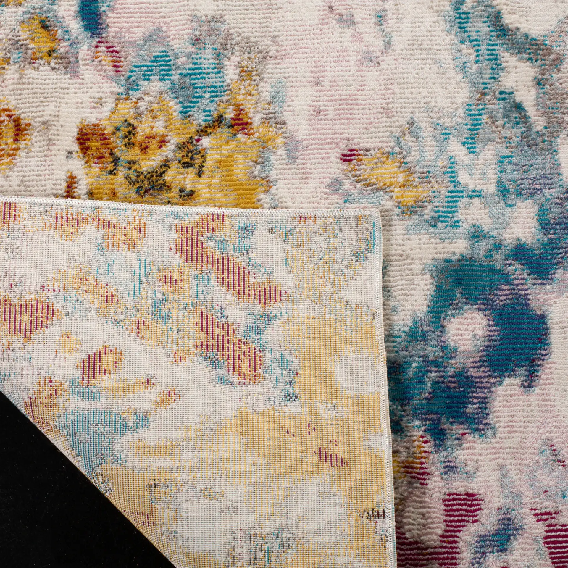 Aria Abstract Splatter Rug in Cream / Dark Teal in a styled room