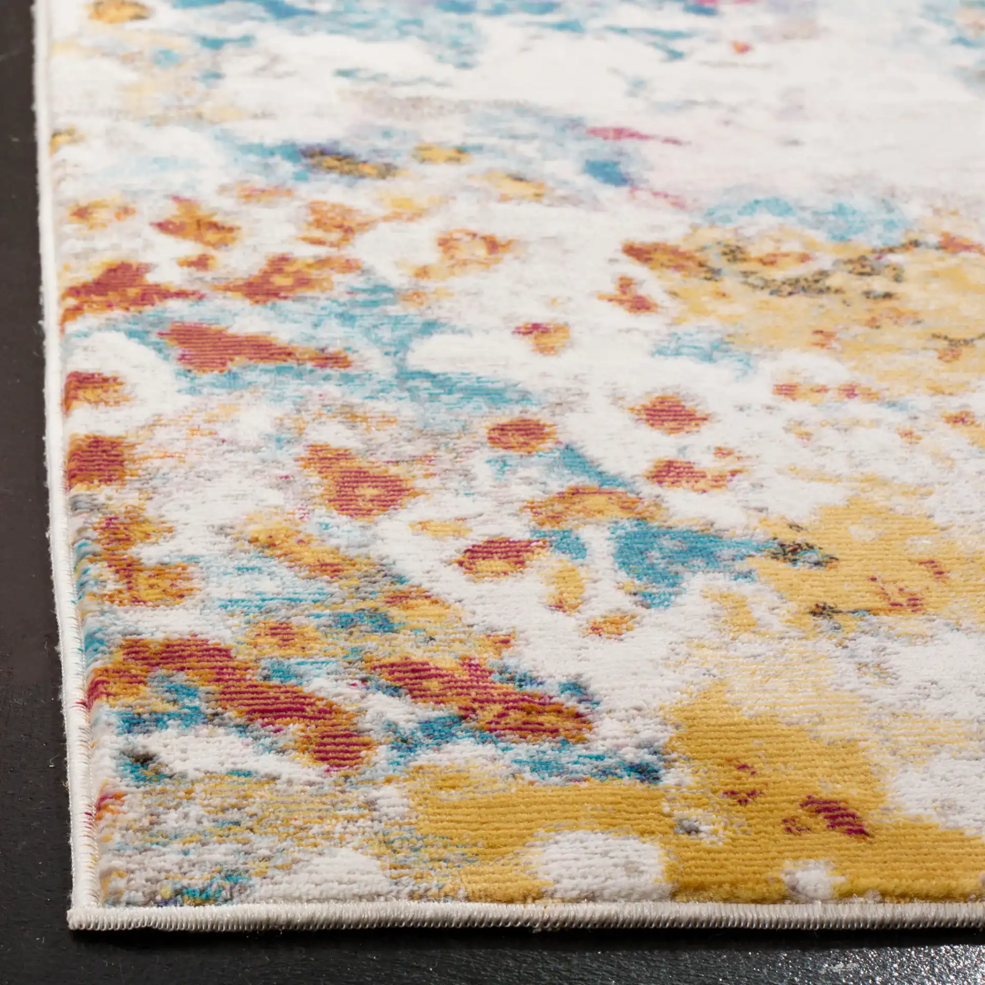 Aria Abstract Splatter Rug in Cream / Dark Teal in a styled room