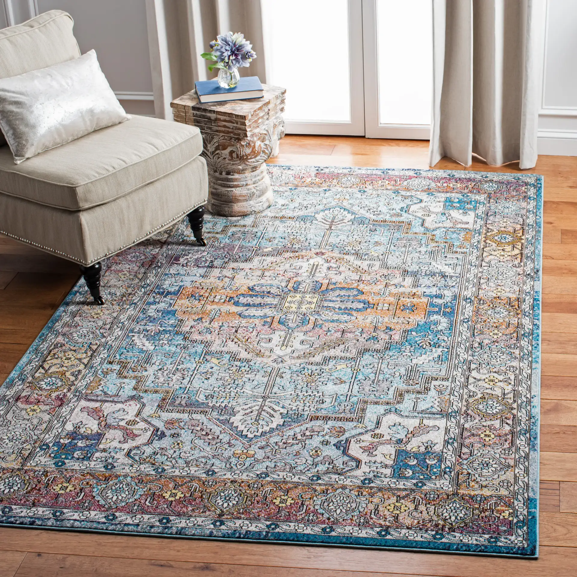 Aria Stepped Medallion Rug in Turquoise / Light Orange in a styled room