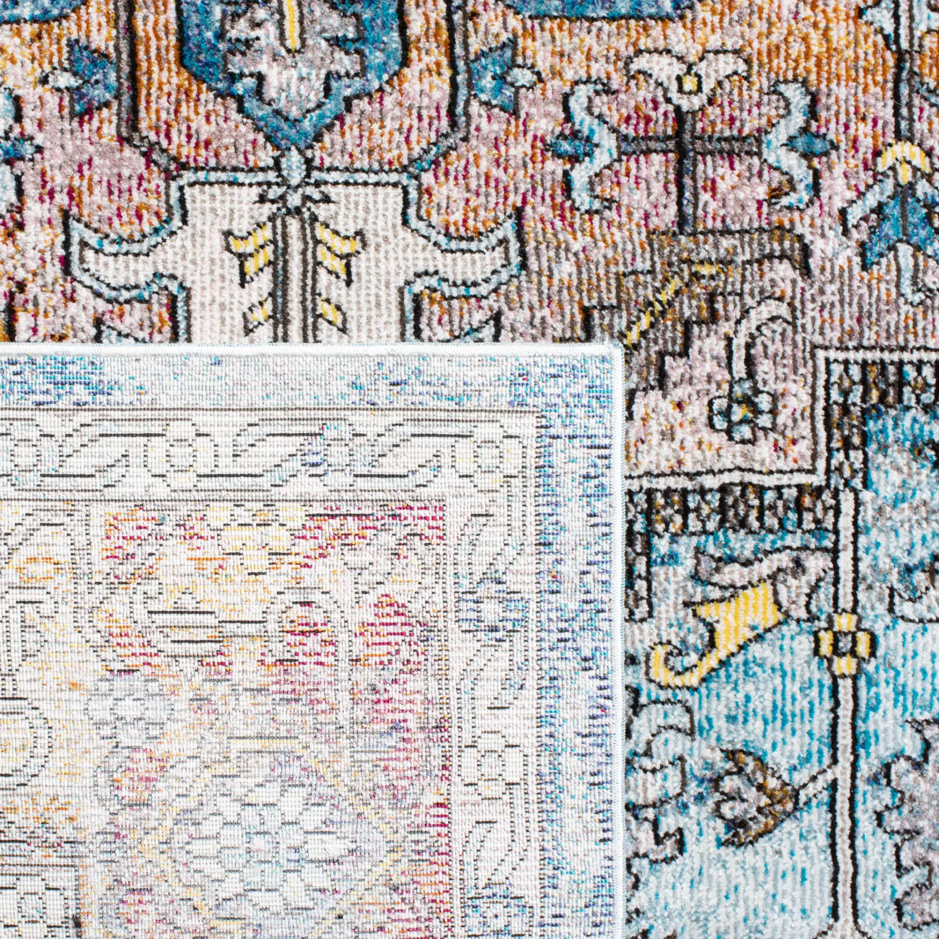 Aria Stepped Medallion Rug in Turquoise / Light Orange in a styled room