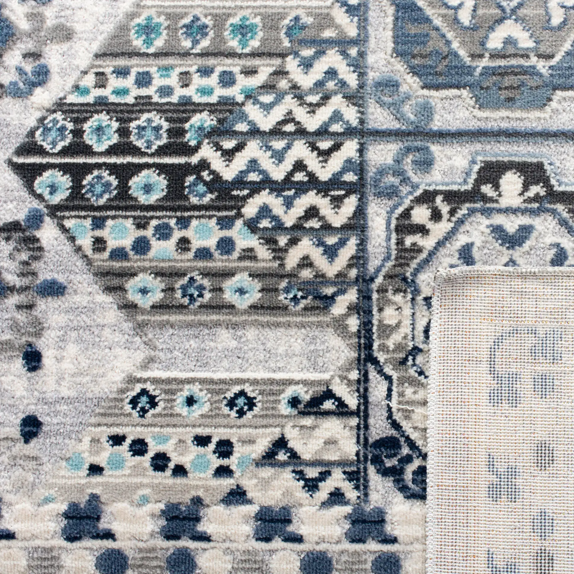 Aria Geometric Medallion Rug in Gray / Cream in a styled room