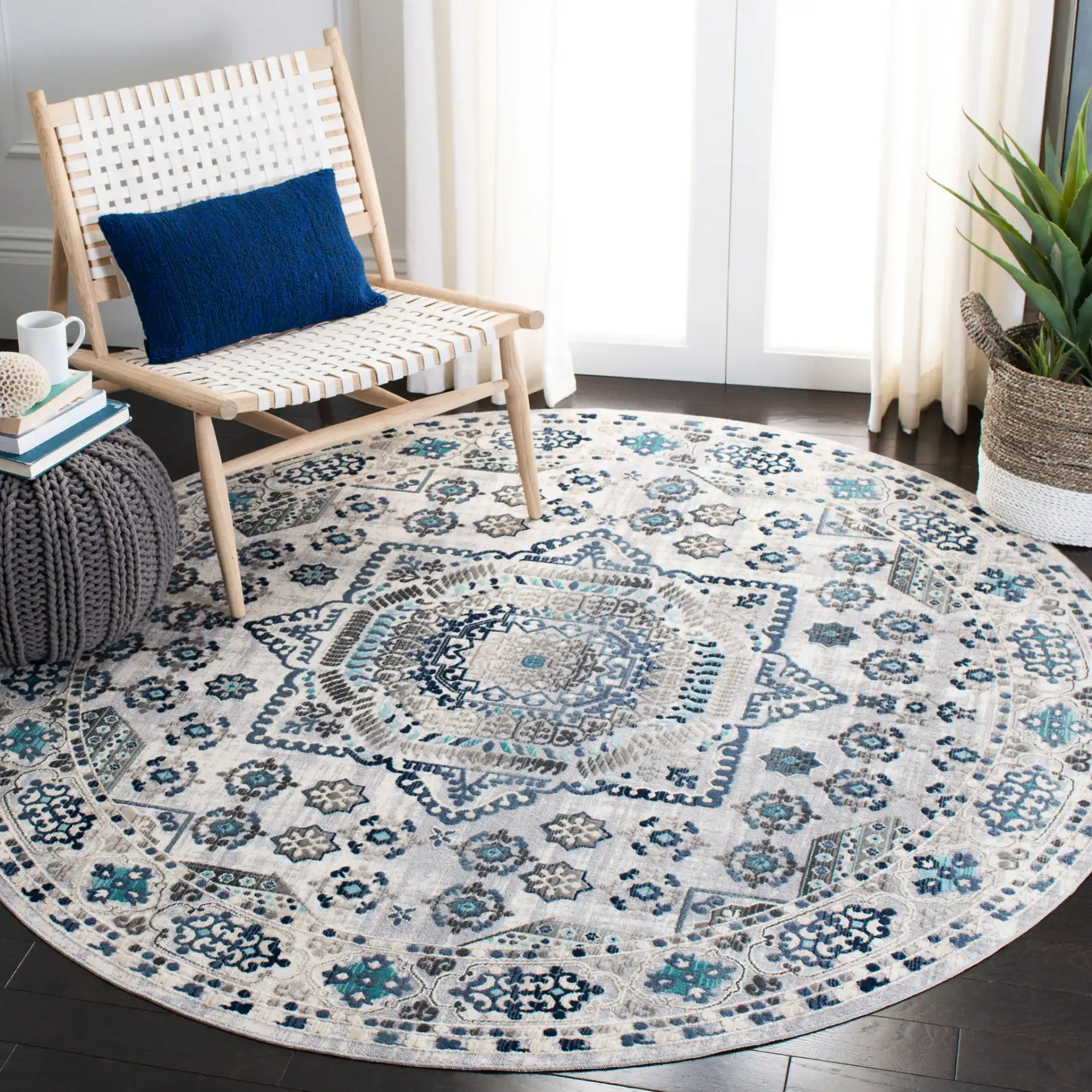 Aria Geometric Medallion Rug in Gray / Cream in a styled room
