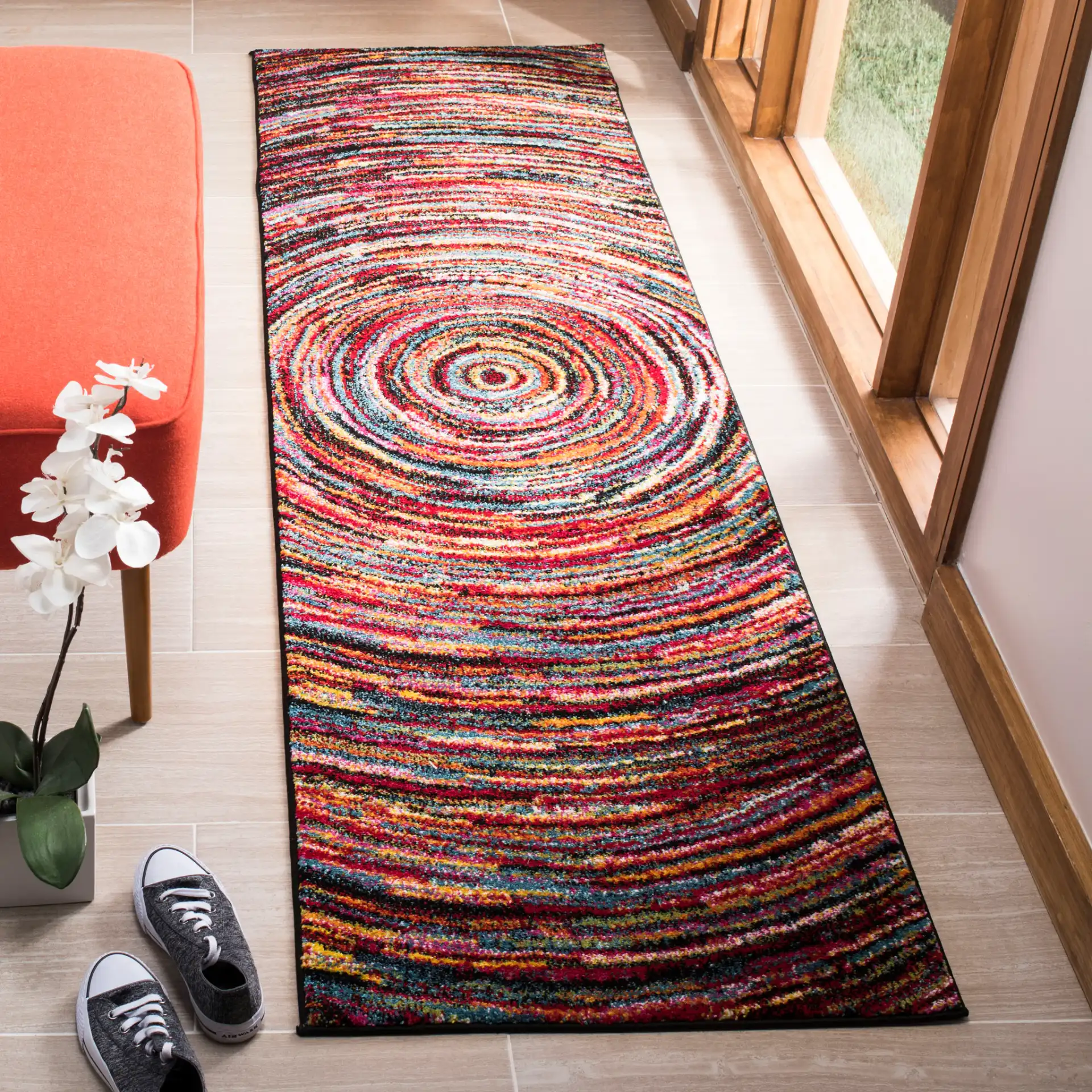 Aruba Concentric Rings Rug in Multicolor in a styled room