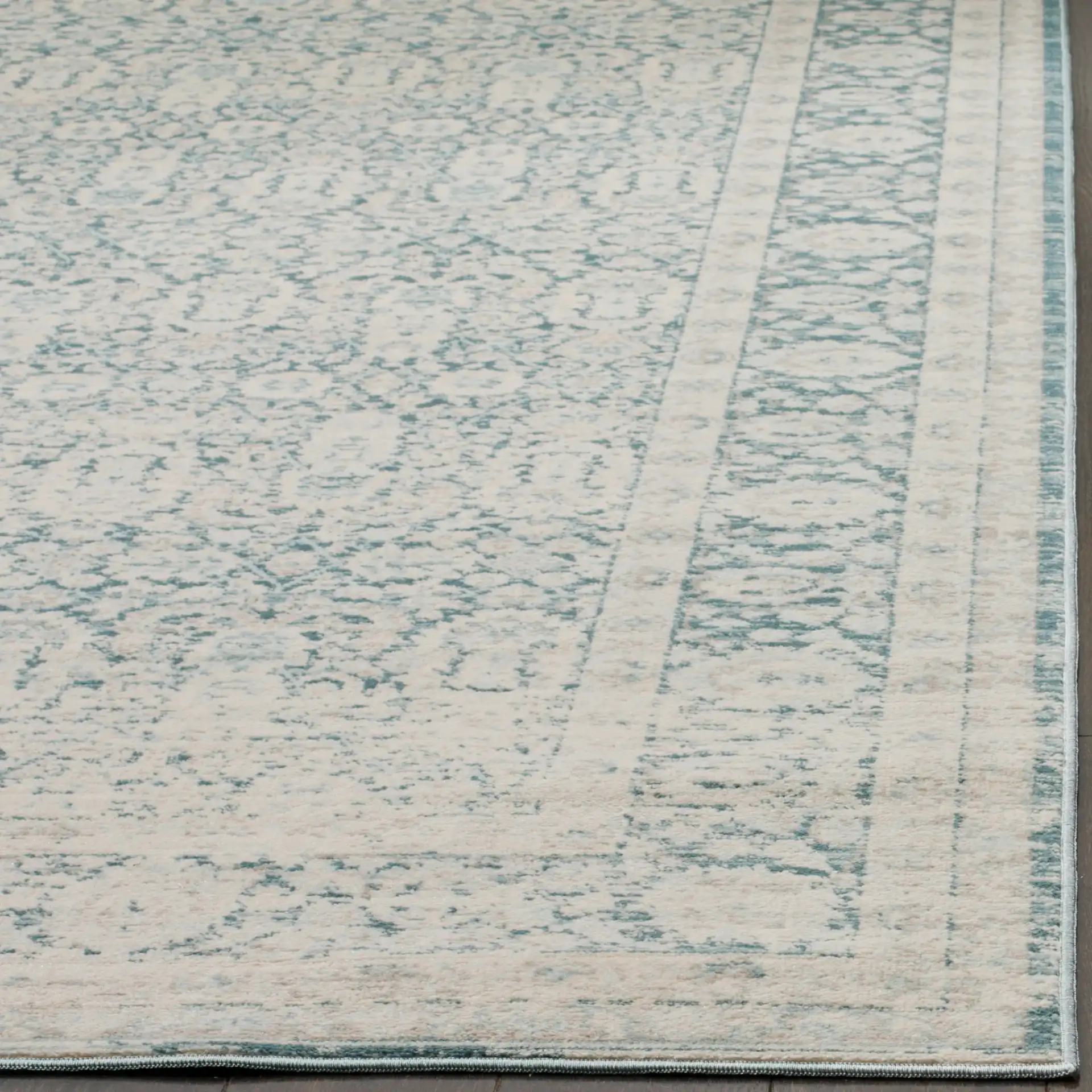 Archive Bordered Floral Rug in Blue / Gray in a styled room