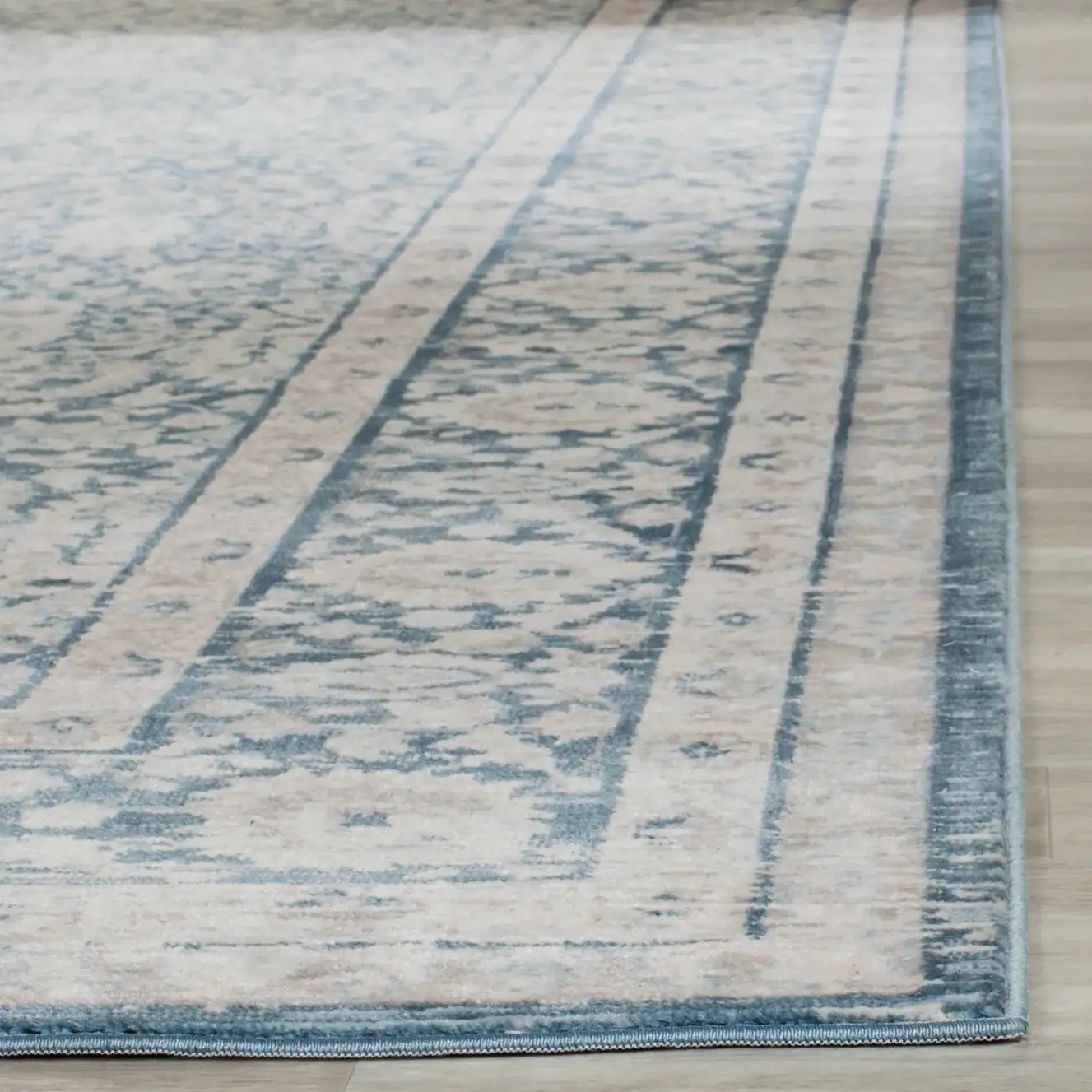 Archive Bordered Floral Rug in Blue / Gray in a styled room
