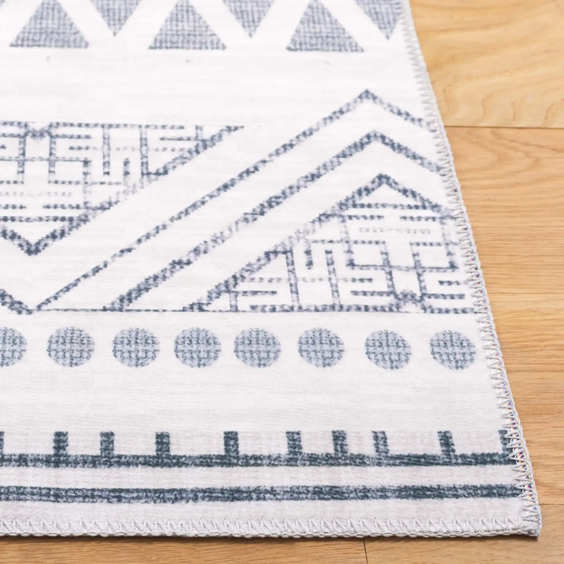 Arizona Banded Diamond Washable Rug in Beige / Charcoal in a styled room