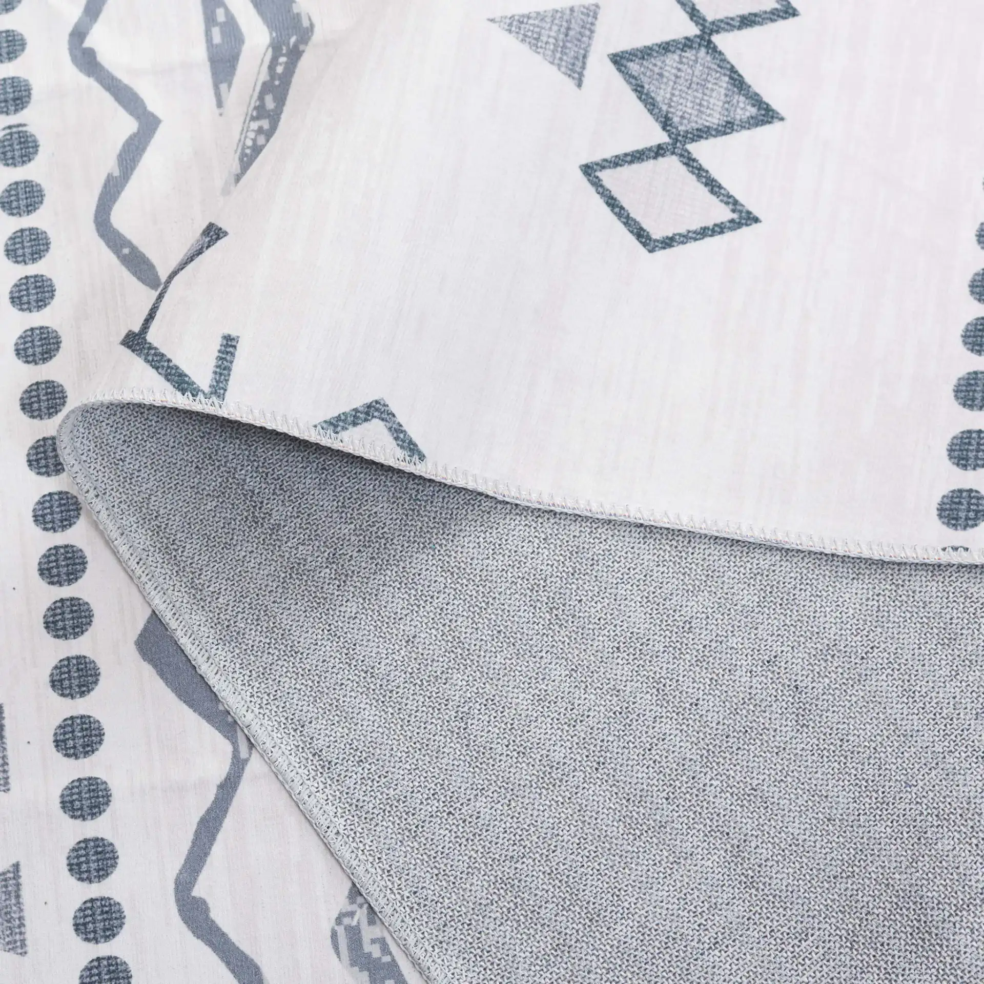 Arizona Banded Diamond Washable Rug in Beige / Charcoal in a styled room