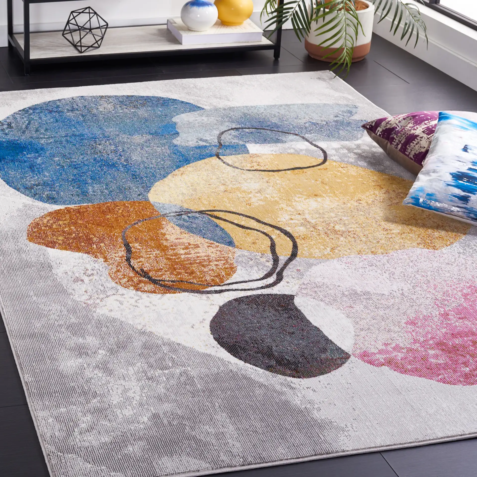 Art Studio Overlapping Shapes Rug in Ivory / Blue in a styled room