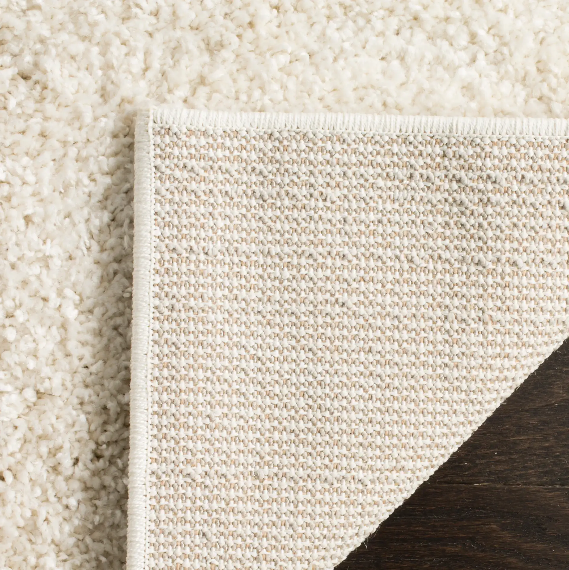 Arizona Solid Shag Rug in Cream in a styled room