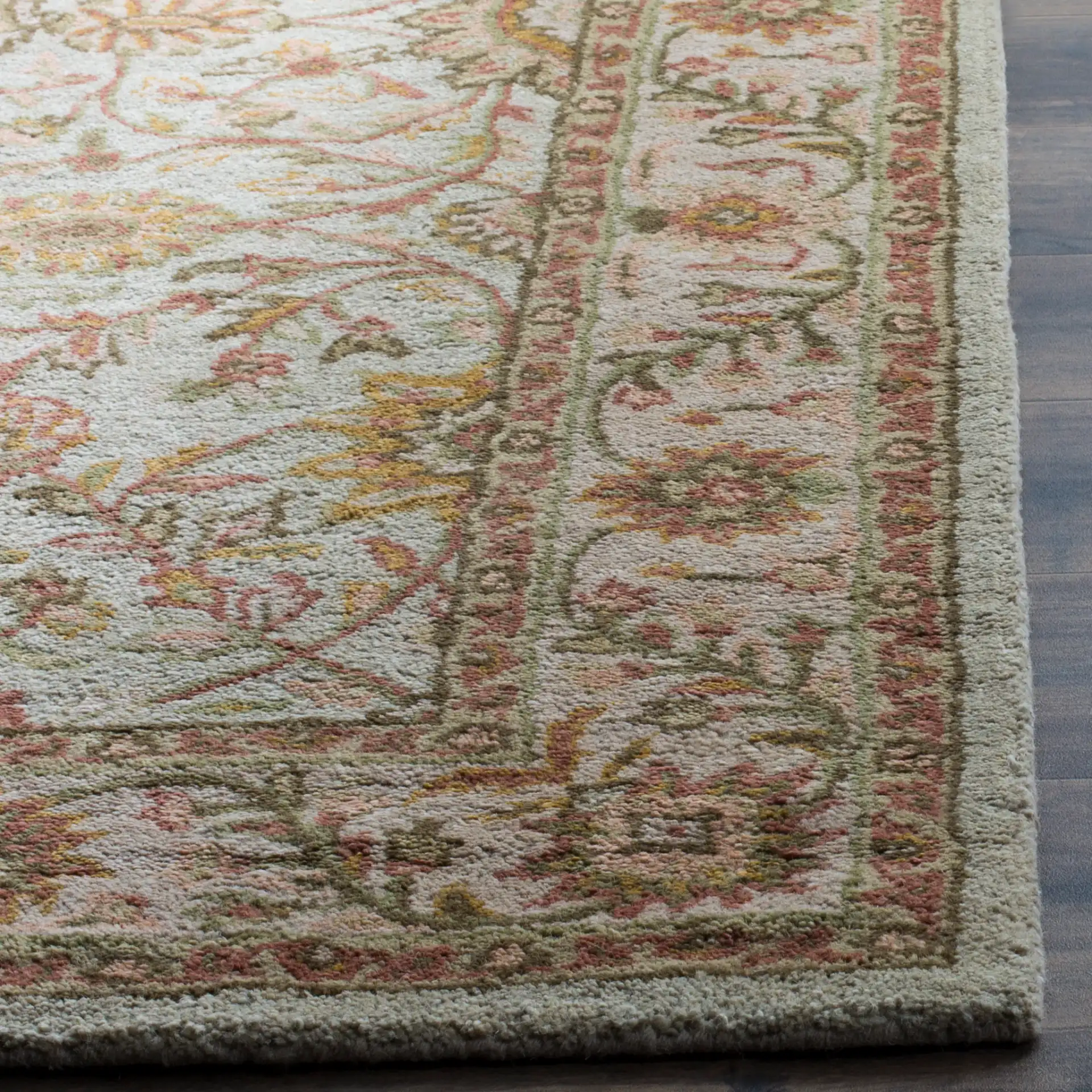 Antiquity Rosette Trellis Hand-Tufted Wool Rug in Ivory / Light Green in a styled room